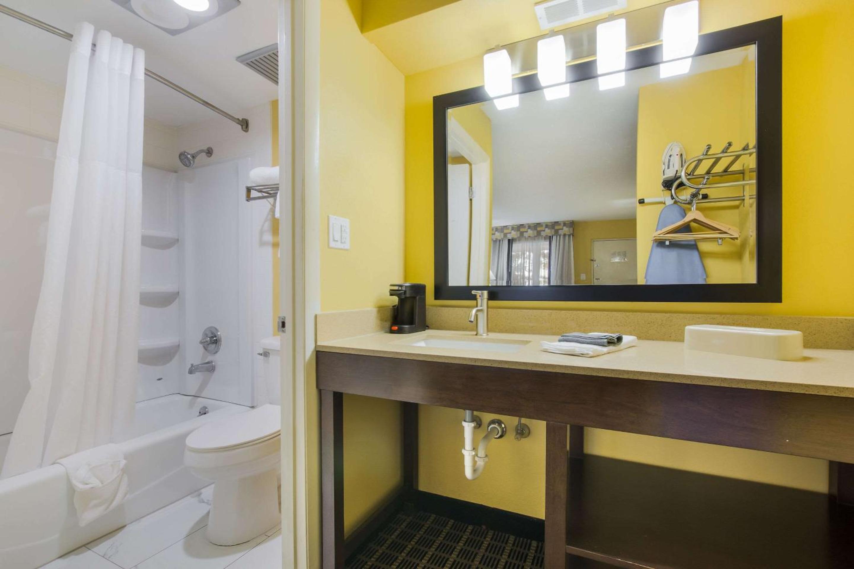 bathroom with a sink, toilet, and bathtub