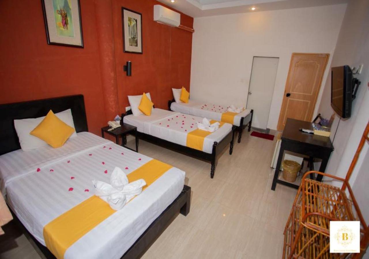 Standard Triple Room - No Window photo 3