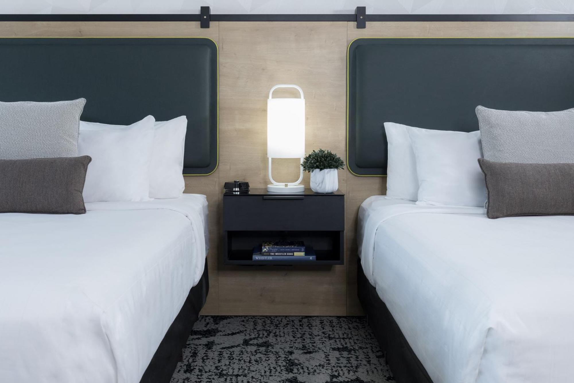 Deluxe Queen Room with Two Queen Beds and Sofa Bed - Photo 2