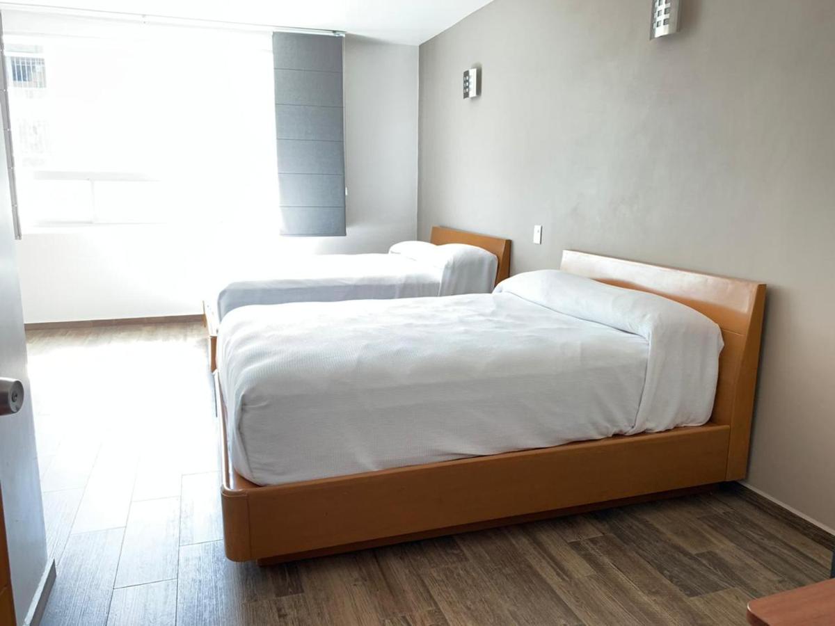 Deluxe Queen Room with Two Queen Beds photo 1