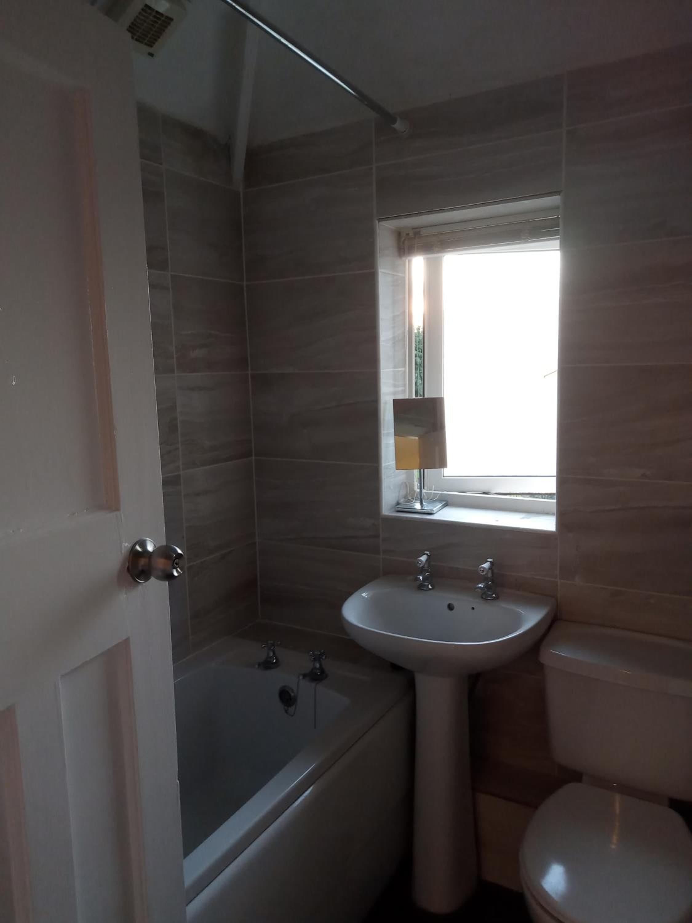 Three-Bedroom Apartment - Photo 18