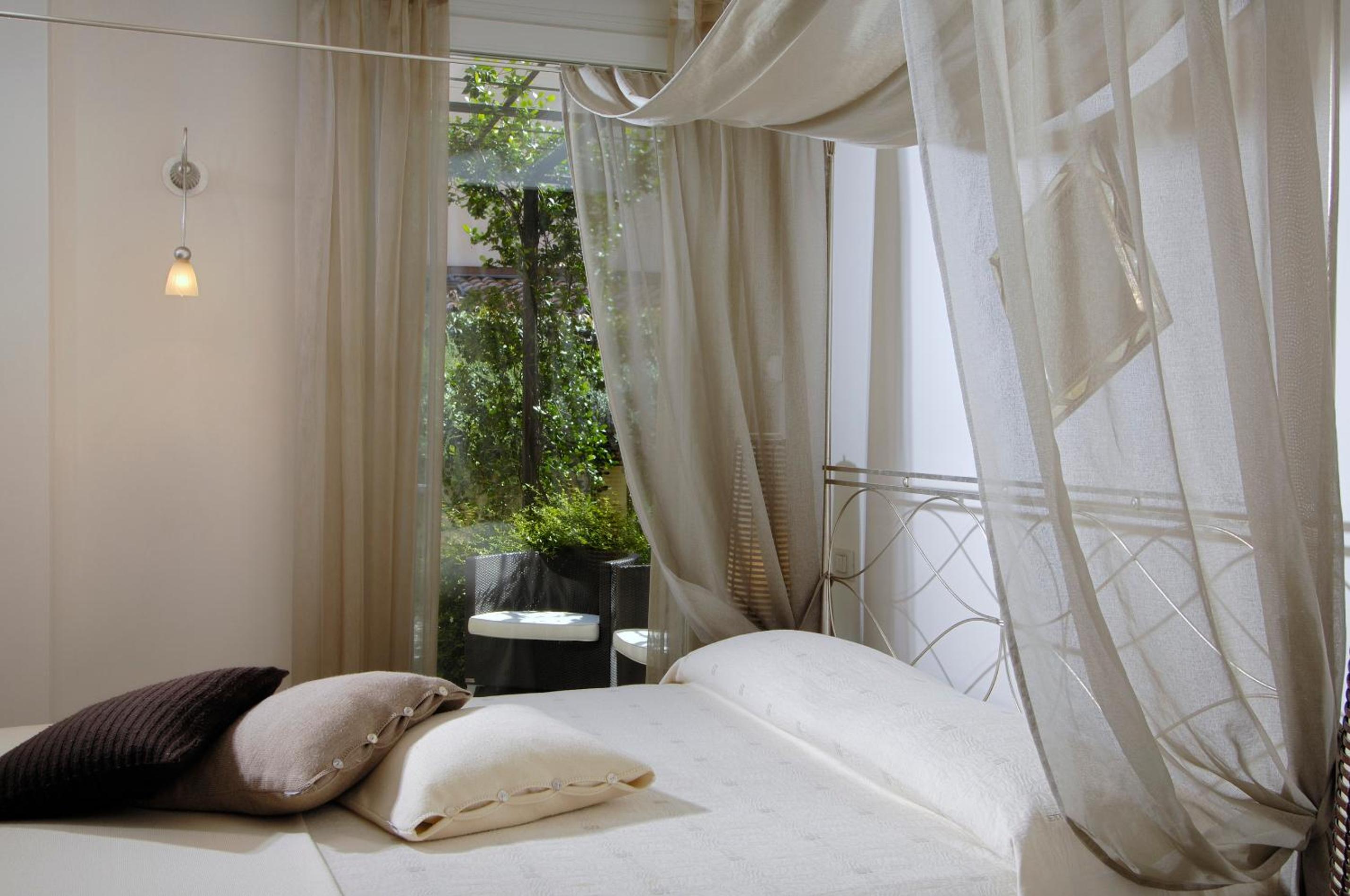 Relax in this serene, stylish hotel room retreat.