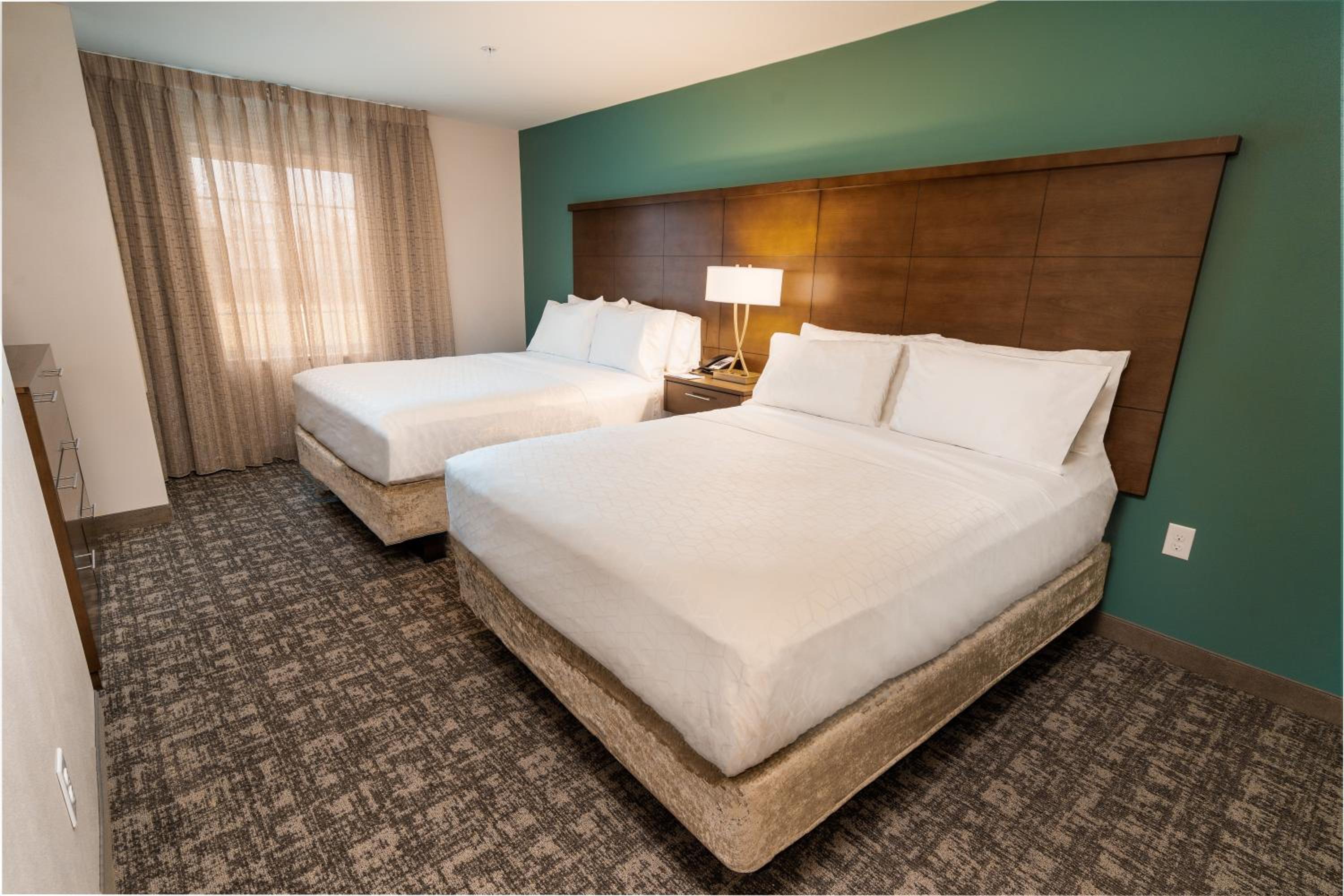 One-Bedroom Queen Suite with Two Queen Beds, Full Kitchen, Sofa Bed, Living Space - Photo 2