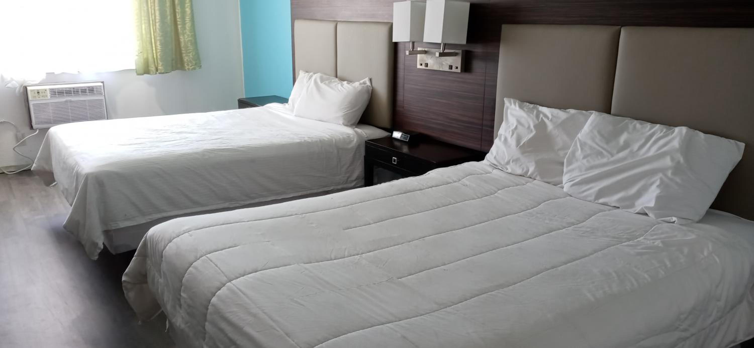 Queen Room with Two Queen Beds - Photo 1