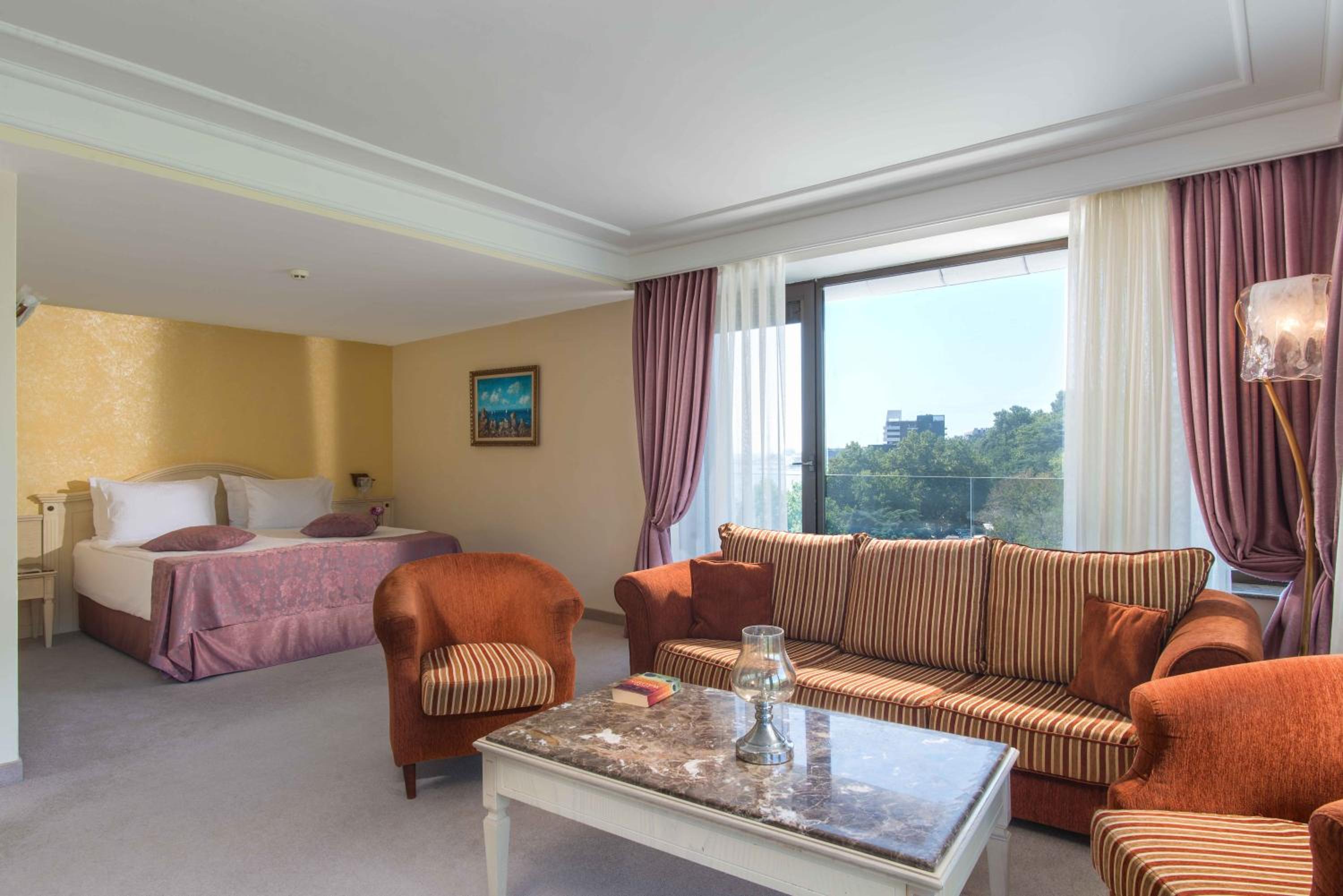 Deluxe Double Room with Balcony and Park View (2 Adults + 2 Children)