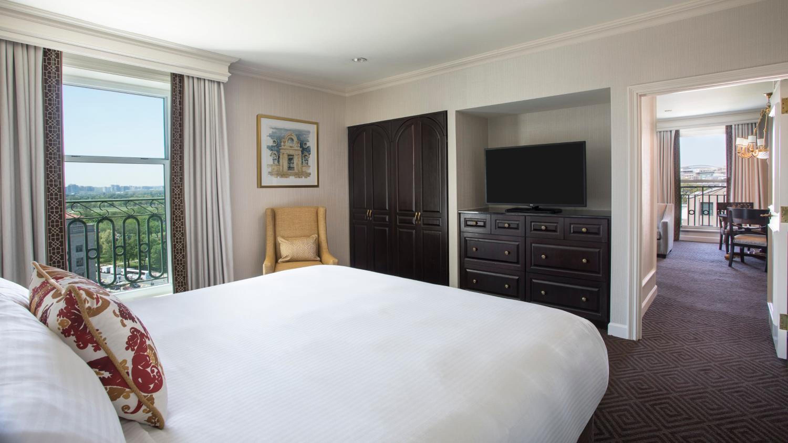 hotel room with a large bed and a flat screen tv