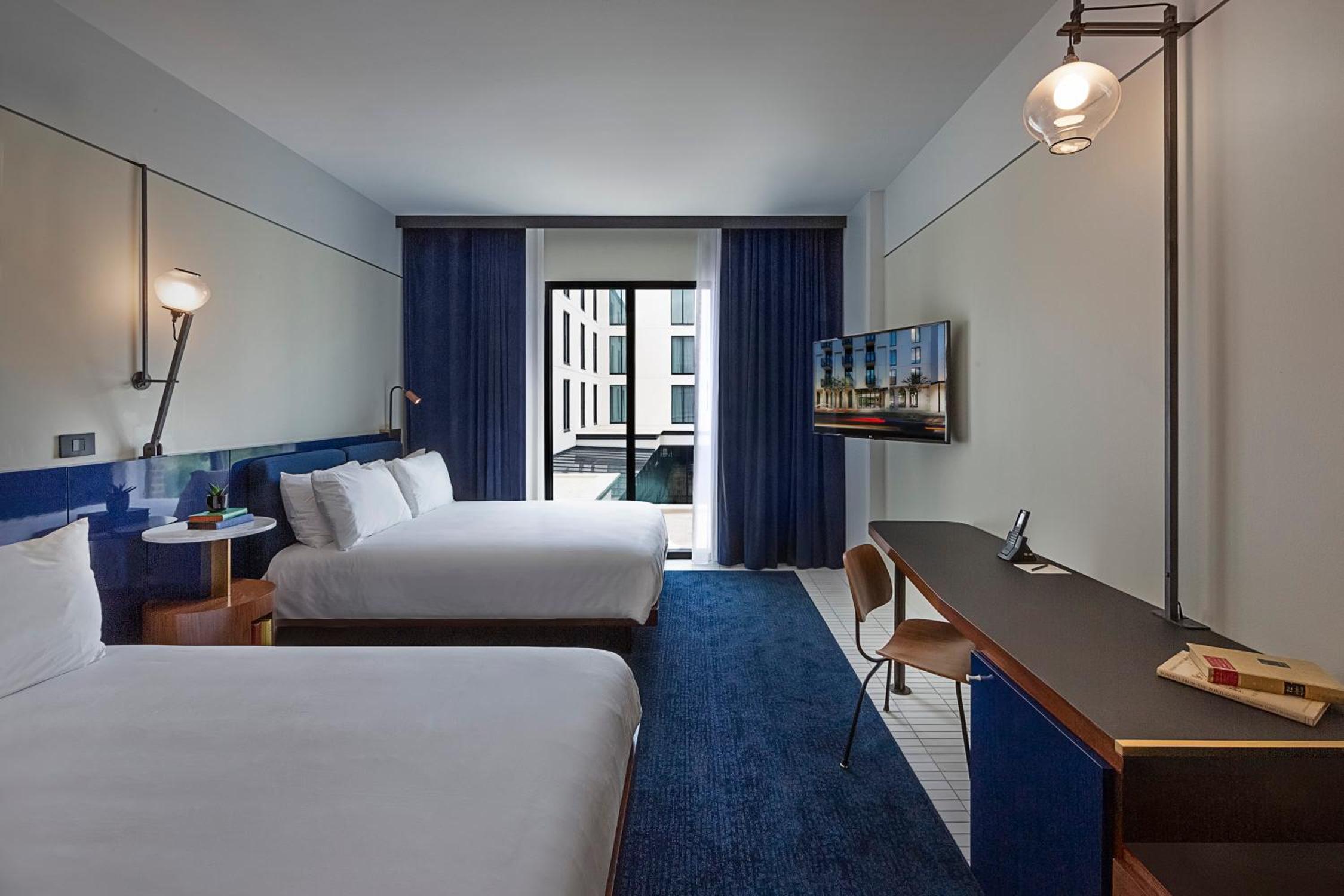 Courtyard Two Queen Guestroom - Photo 1