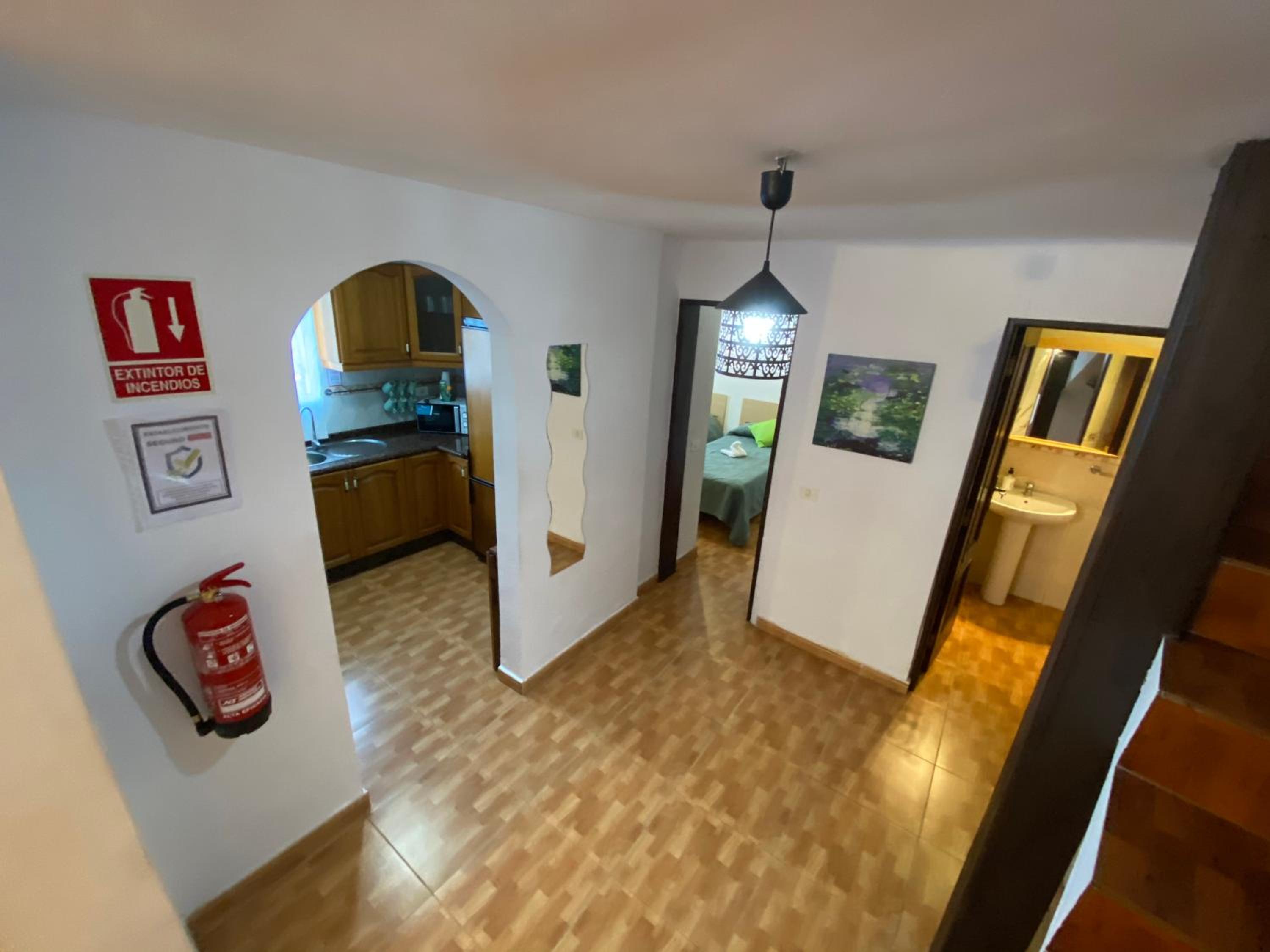 Three-Bedroom House - Photo 25
