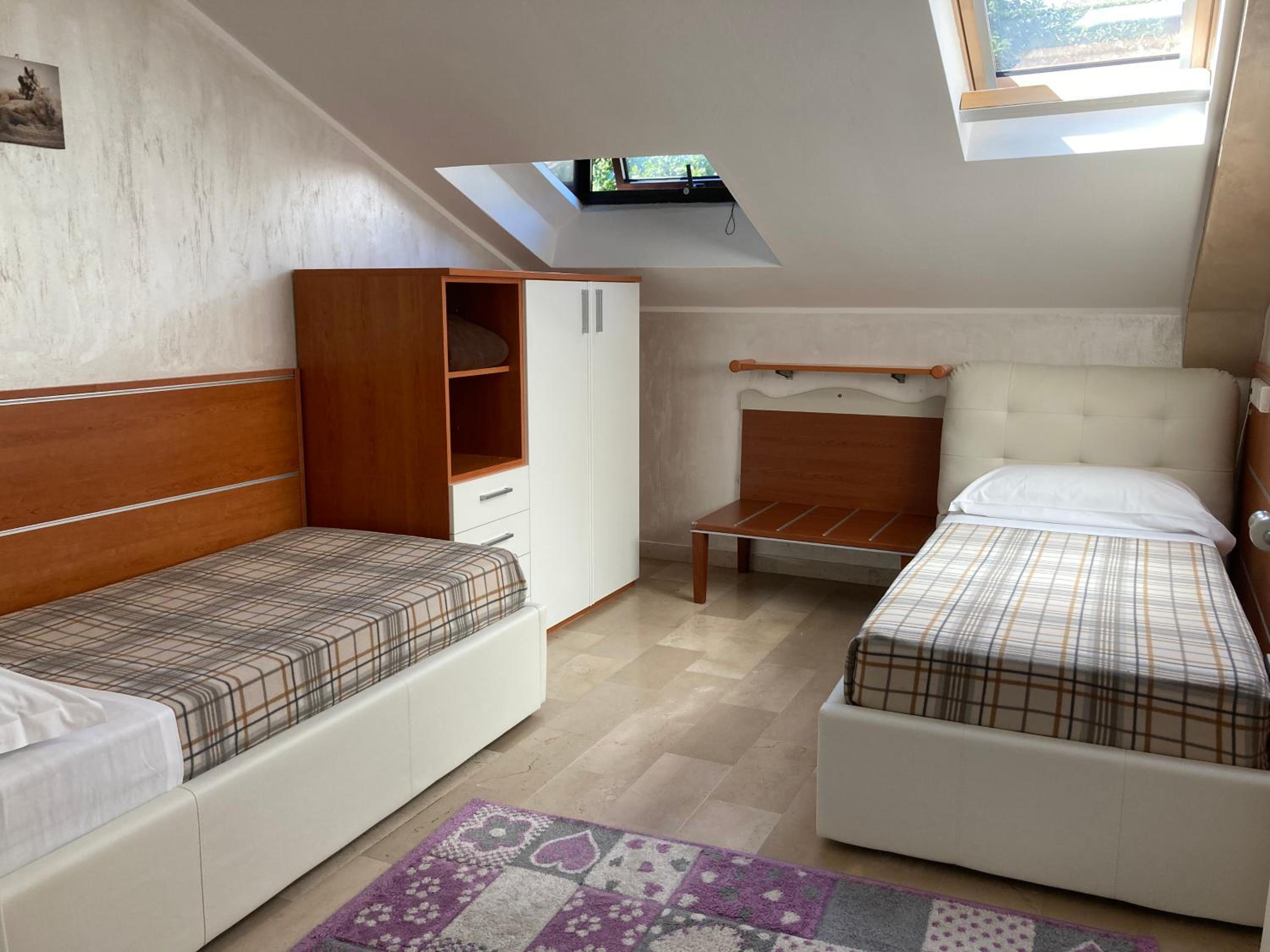 Three-Bedroom Apartment with Balcony and Garden View