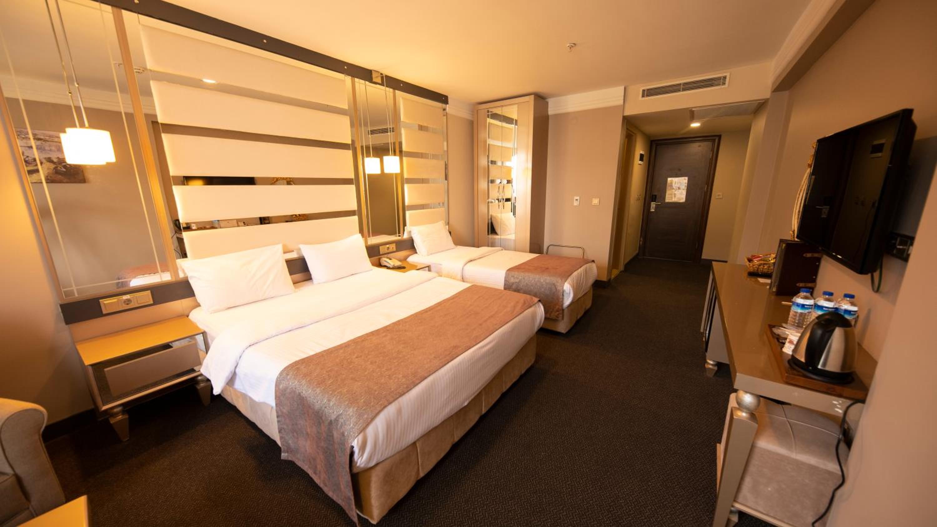 Family Room with 1 King Bed + 2 Single Beds