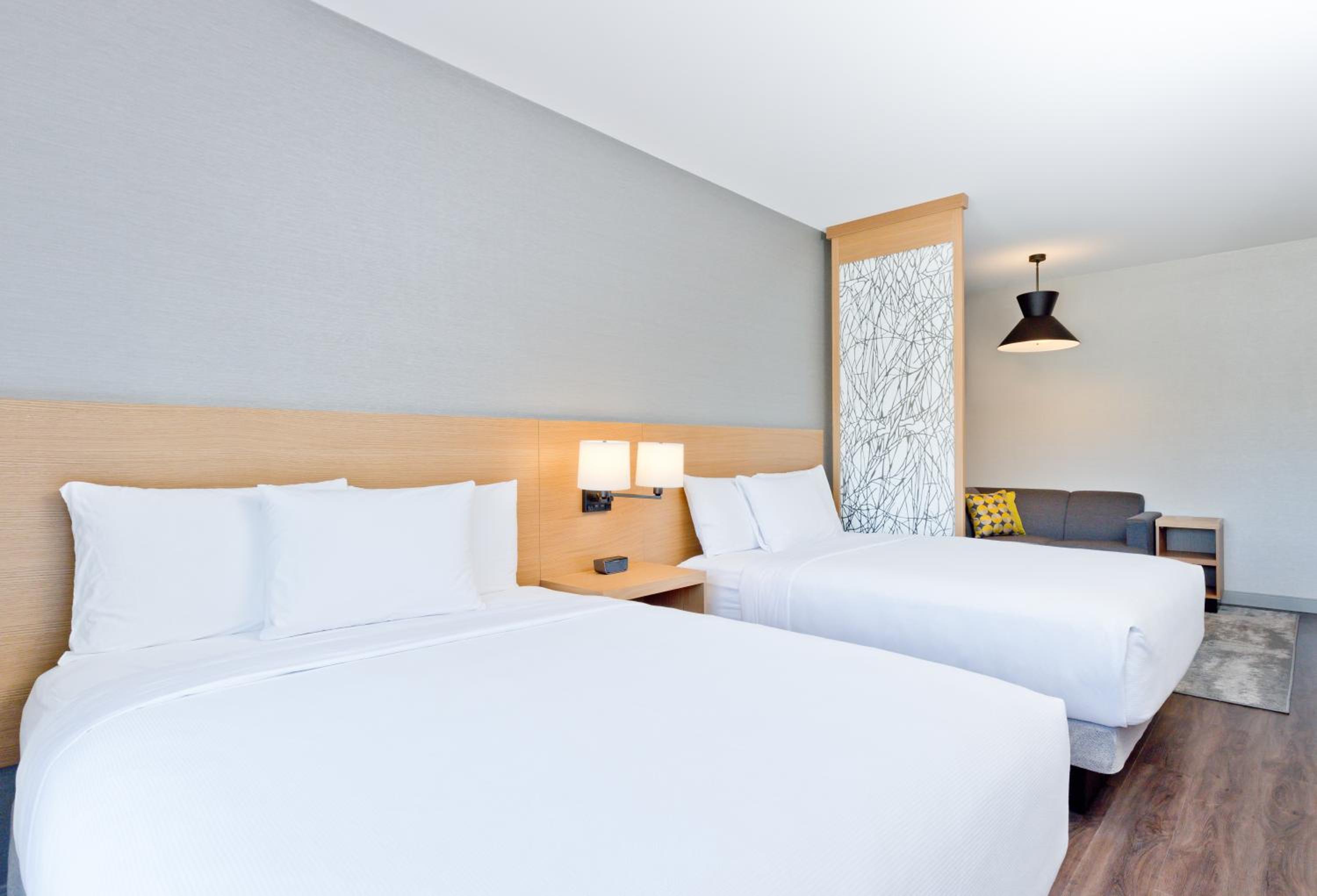 Queen Room with Two Queen Beds and Sofa Bed - Photo 2