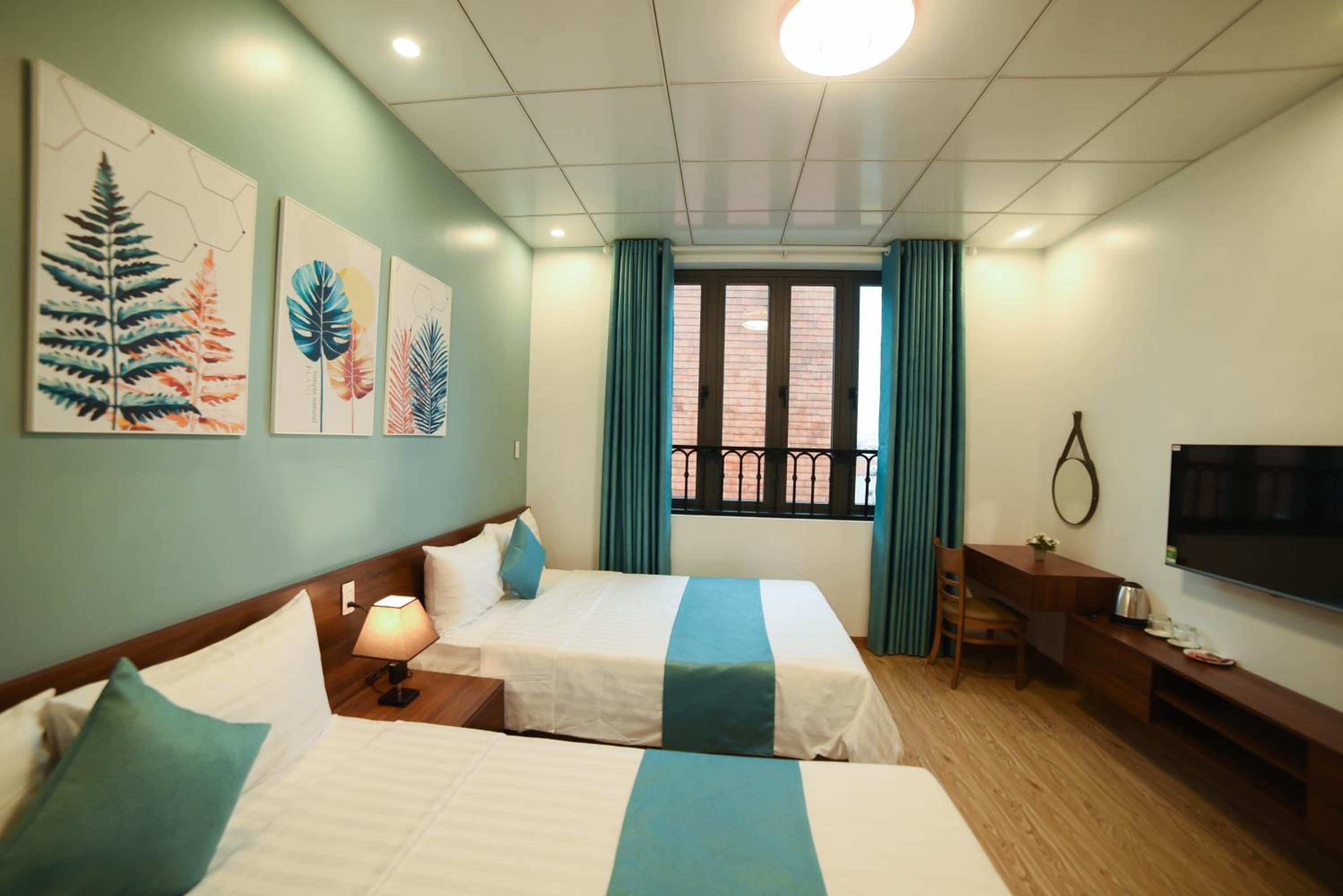 Deluxe Quadruple Room - Photo 5