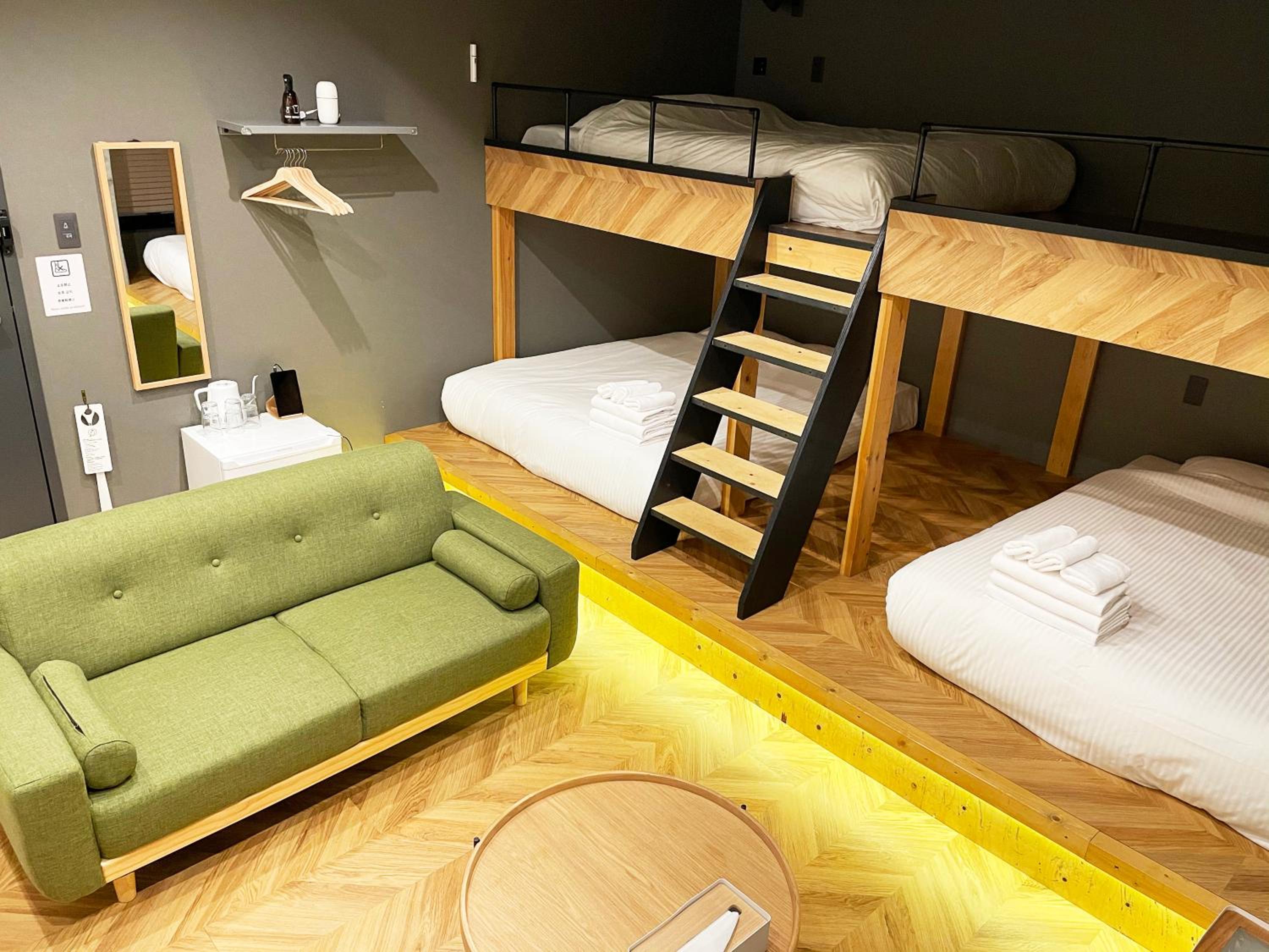 Deluxe Room with Shower (3 Double Beds and 1 Sofa) - Disability Access - Non-Smoking - No Cleaning for Consecutive Night Stays photo 1