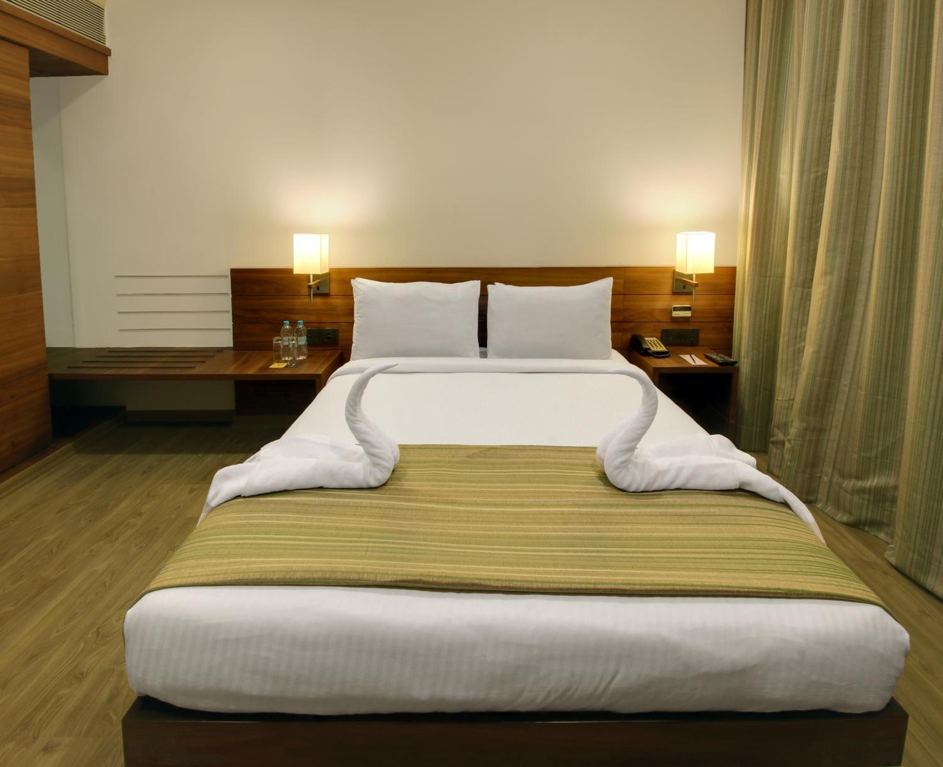 Deluxe Room with Complimentary Shuttle Pickup and Drop to Sai Baba Temple and Guaranteed early check in and late Check out upto 3 hours (Subject to availability) photo 1