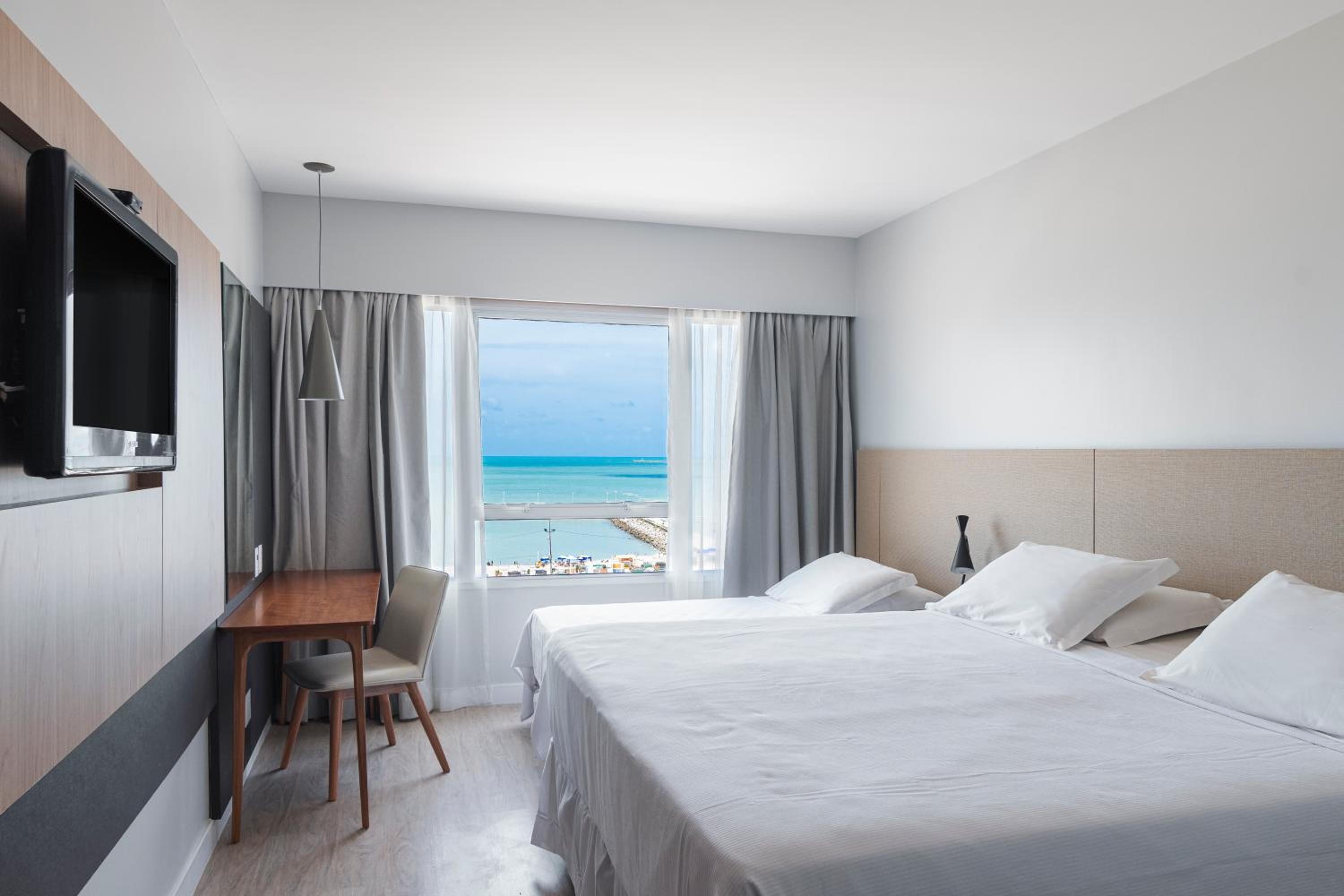 Quarto Triplo Superior casal vista mar