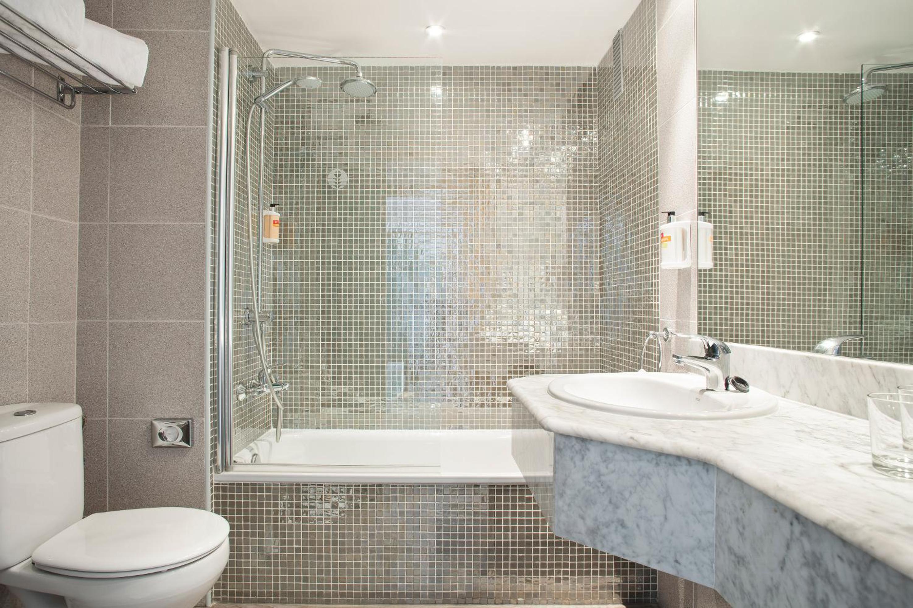 Relax in this stylish and modern bathroom retreat.