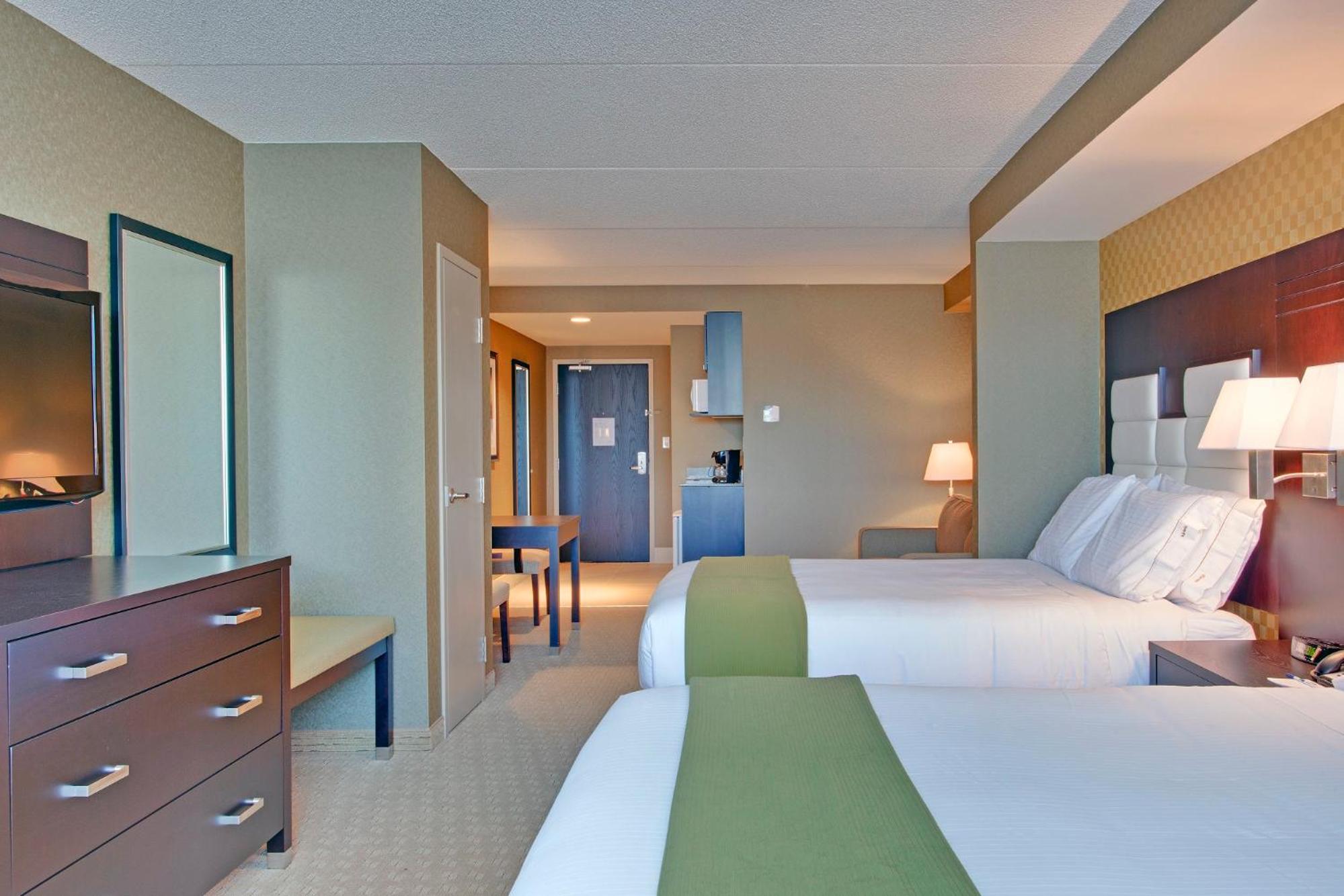 Queen Suite with Two Queen Beds and Sofa Bed - Photo 1