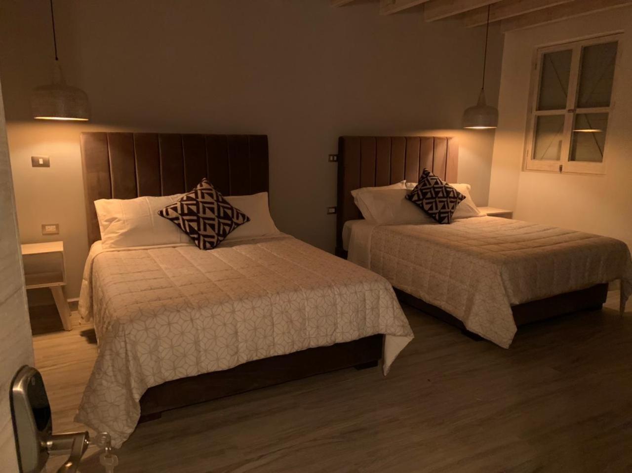 Deluxe Queen Room with Two Queen Beds - Photo 9