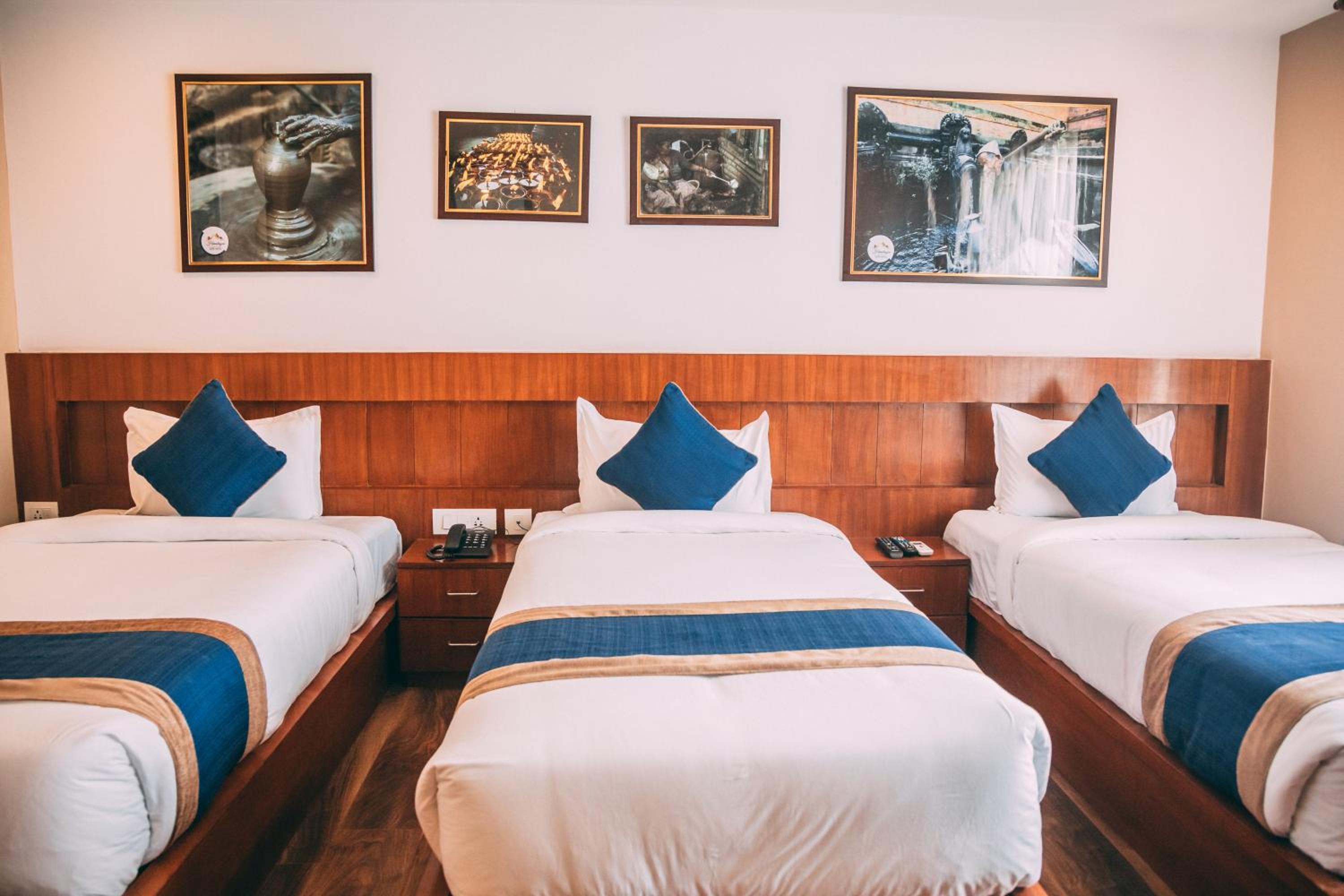 Deluxe Triple Room - Photo 10