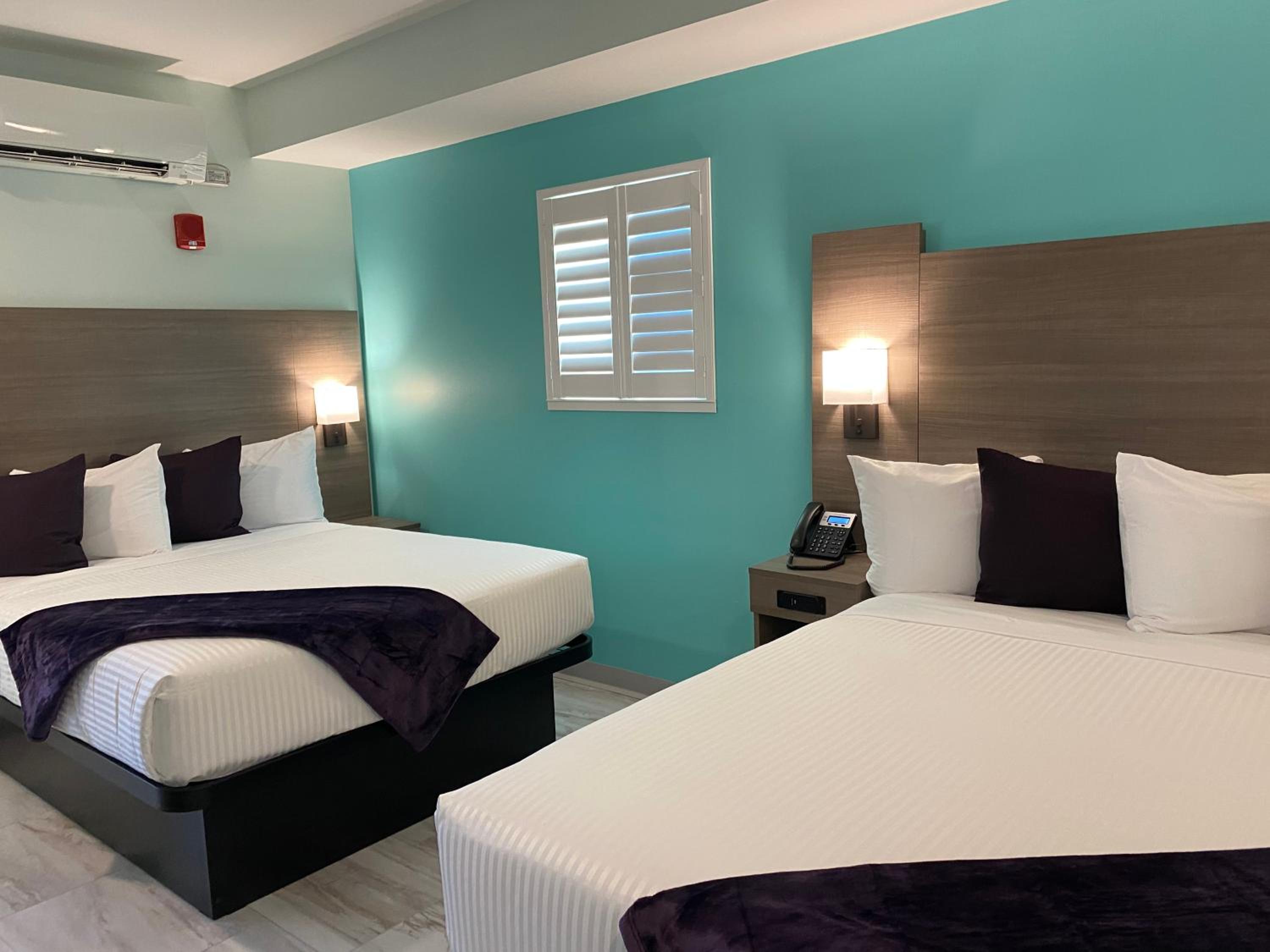 Queen Room with Two Queen Beds - Photo 1