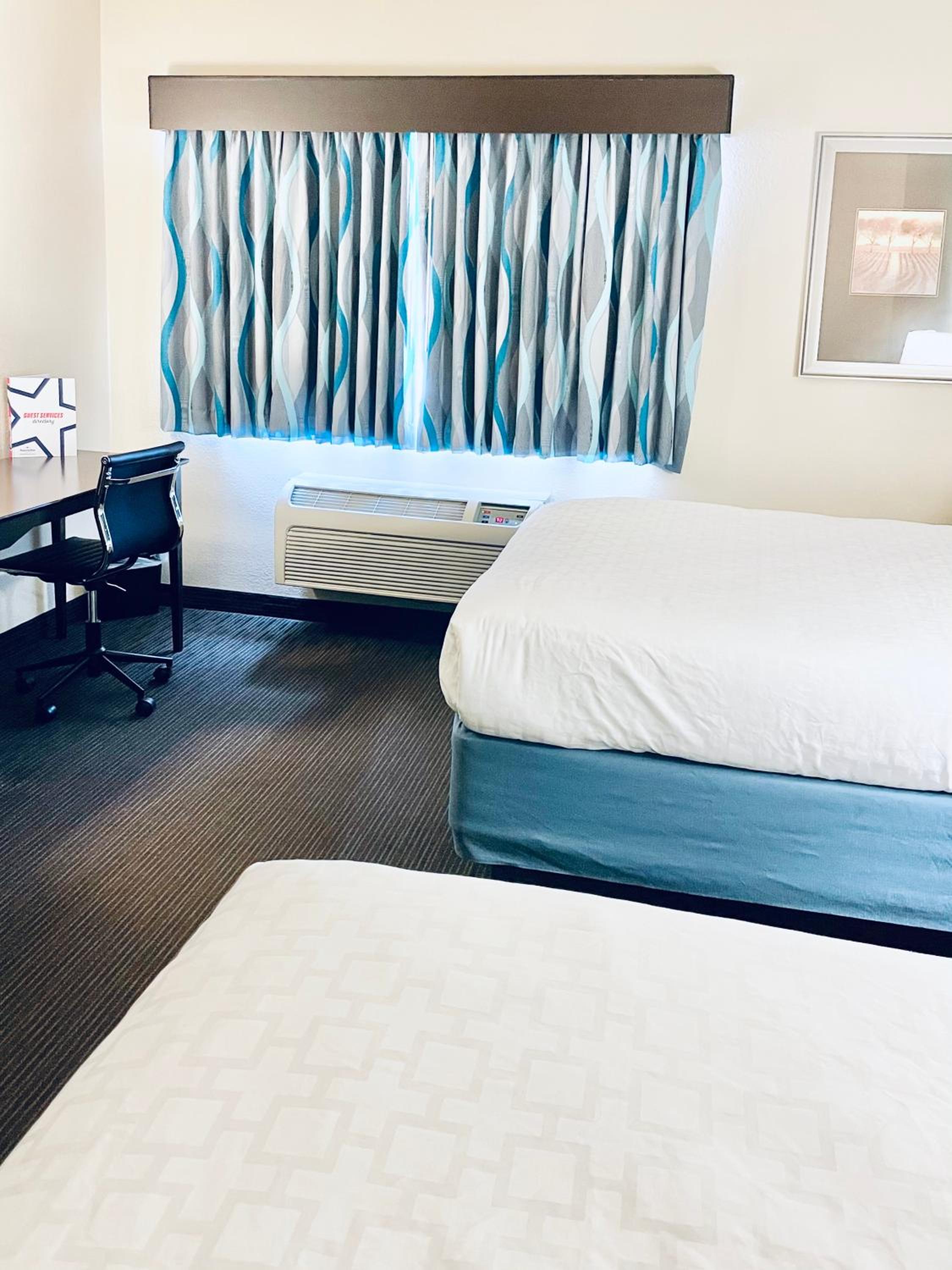 Deluxe Queen Room with Two Queen Beds - Non-Smoking photo 1