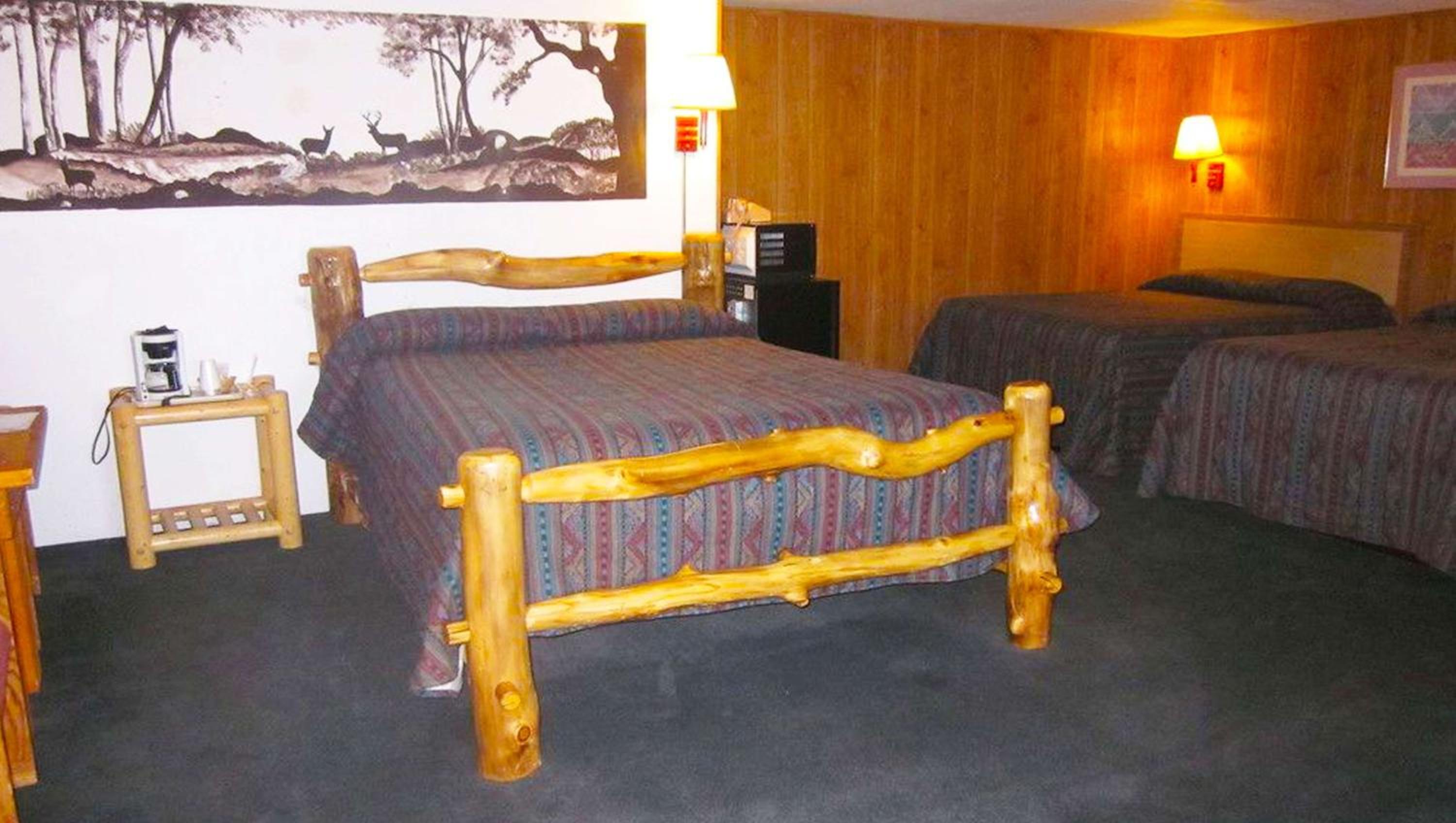 Queen Room with Three Queen Beds - Photo 1