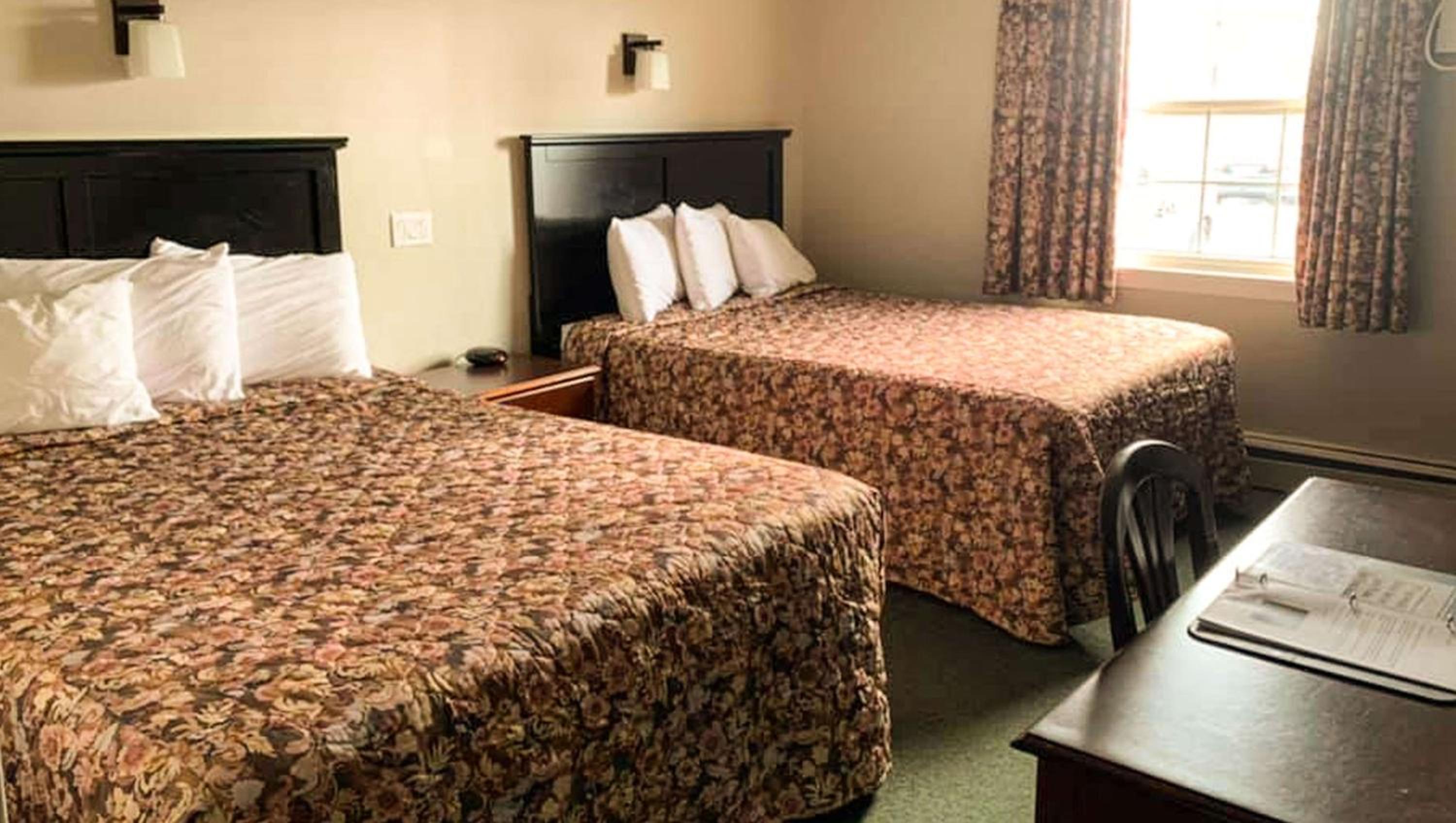 Queen Room with Two Queen Beds - Photo 1