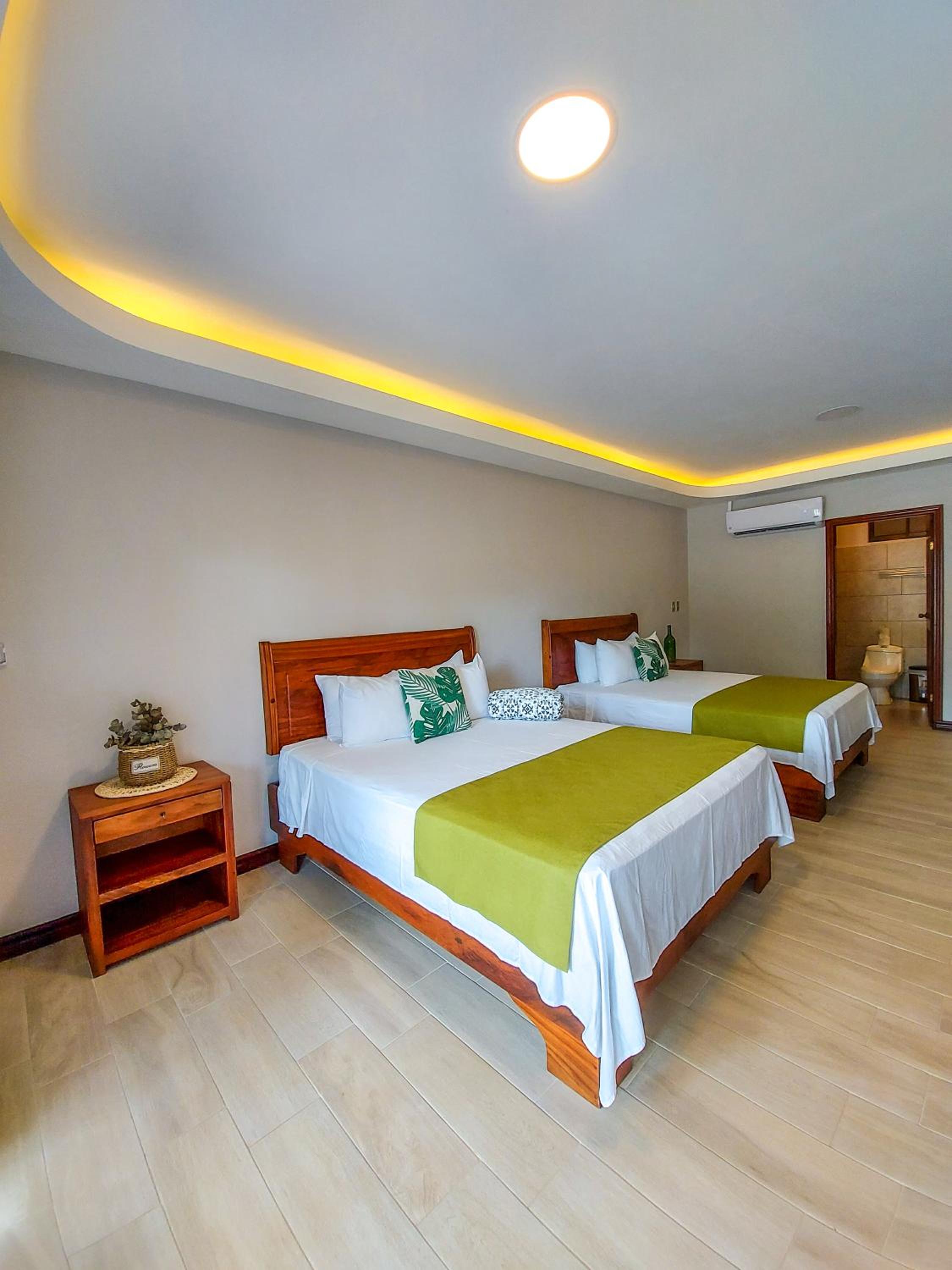 Standard Queen Room with Two Queen Beds - Photo 1