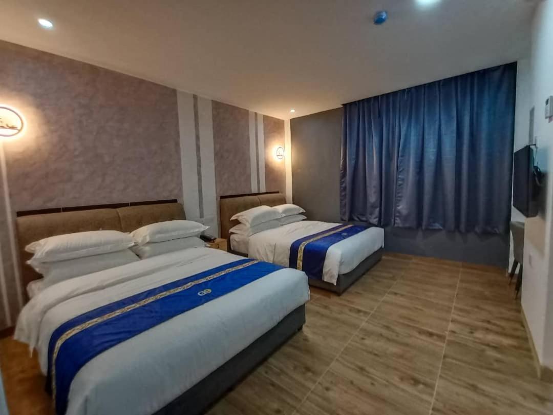 Deluxe Queen Room with Two Queen Beds - Photo 1