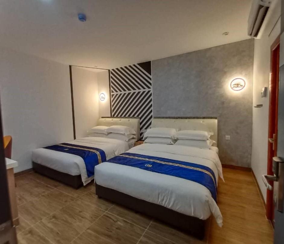 Superior Queen Room with Two Queen Beds - Photo 1