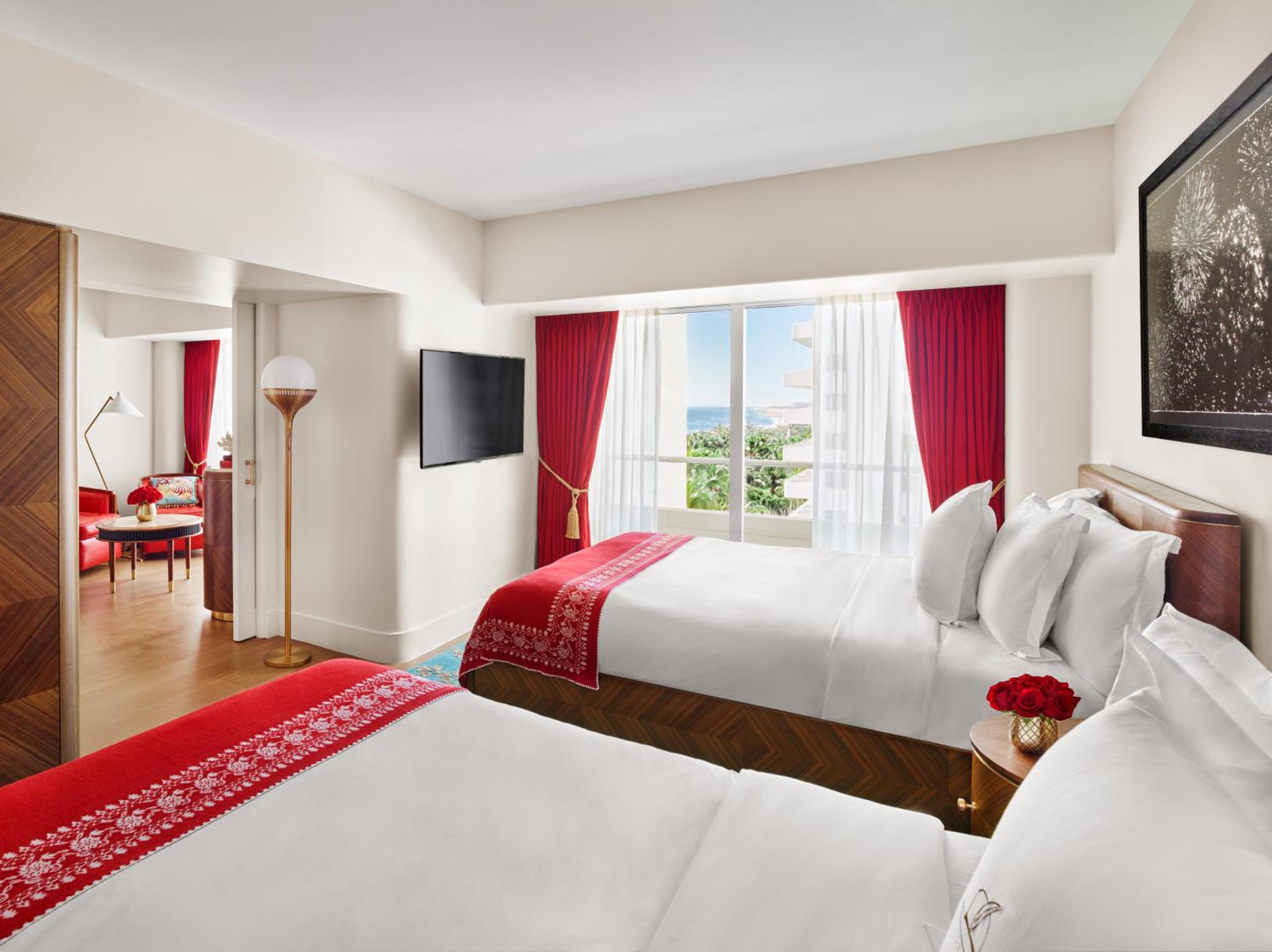 Junior Suite with Two Queen Beds and Partial Ocean View