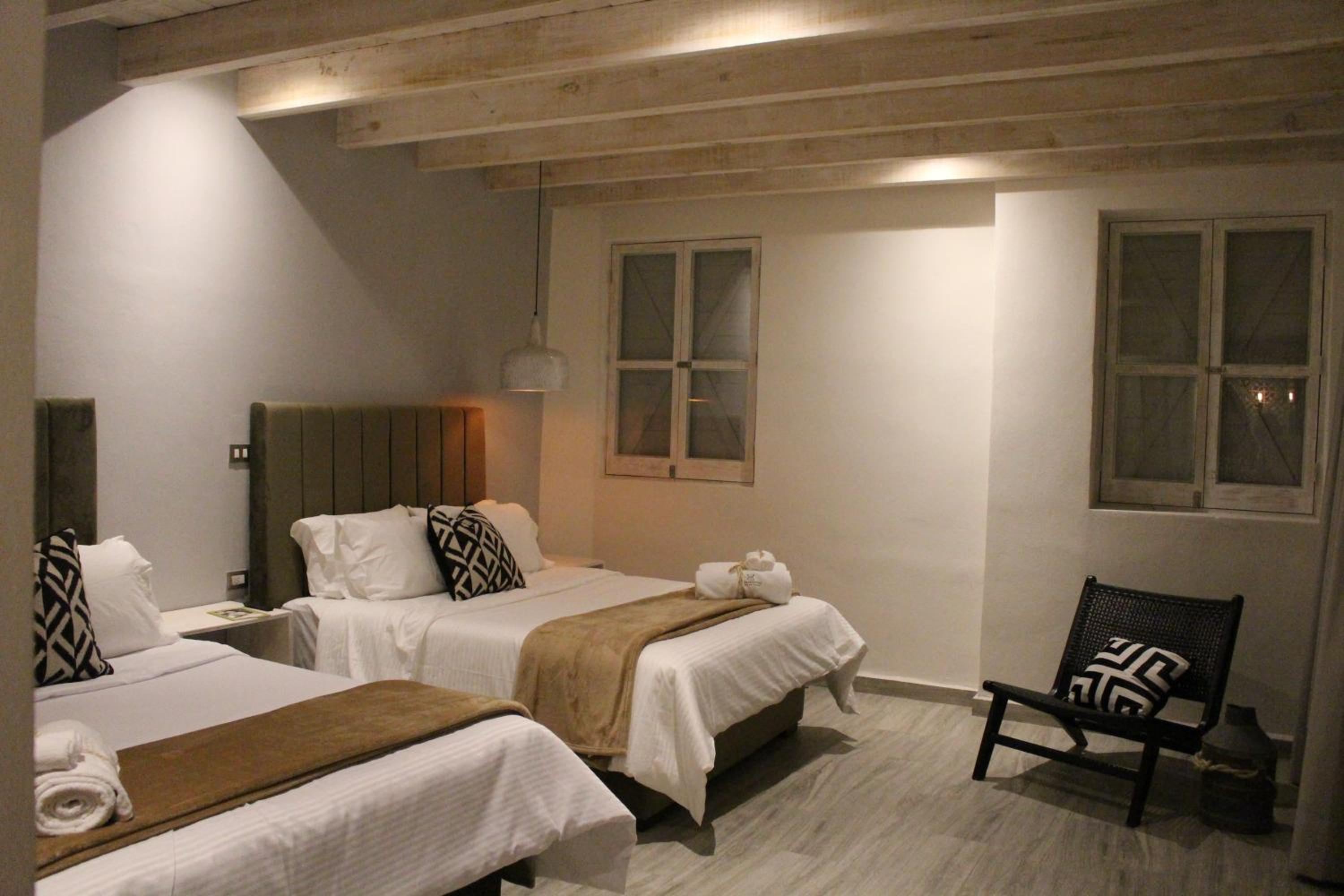 Deluxe Queen Room with Two Queen Beds - Photo 1