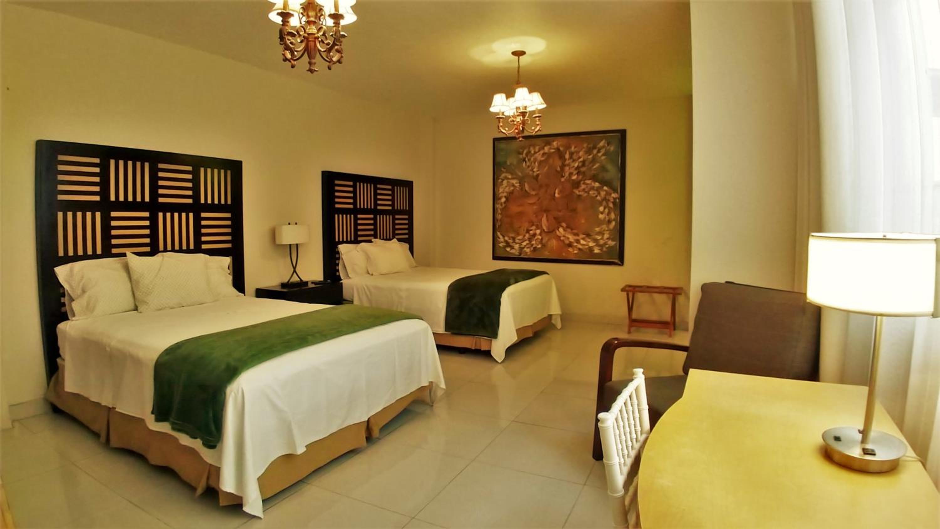 Standard Queen Room with Two Queen Beds - Photo 1