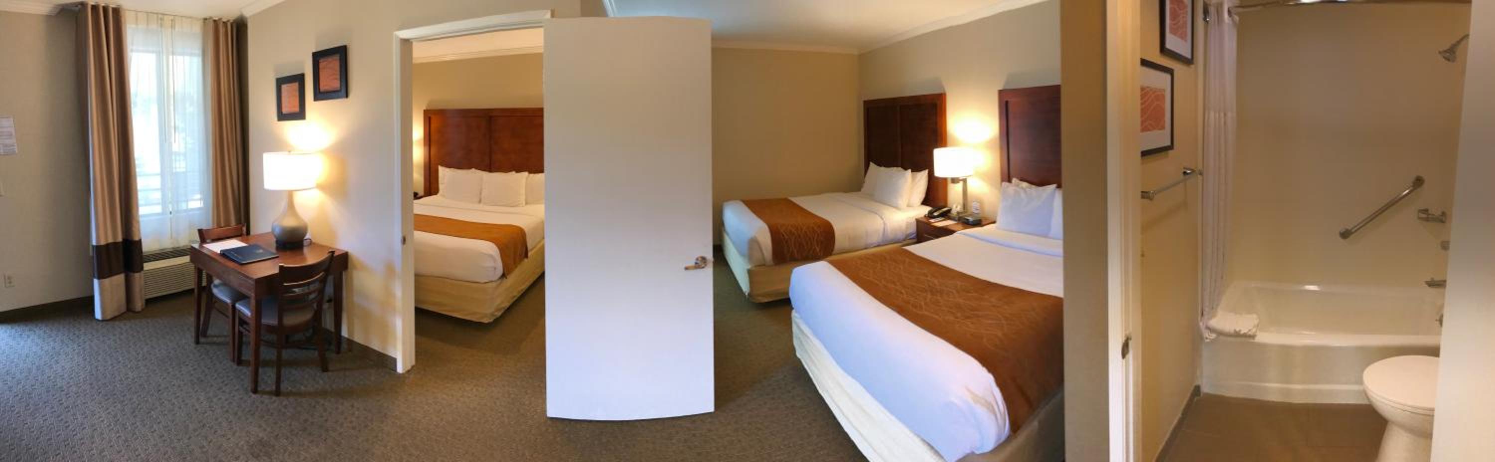 Deluxe King Suite with Two Queen Beds - Non-Smoking photo 1