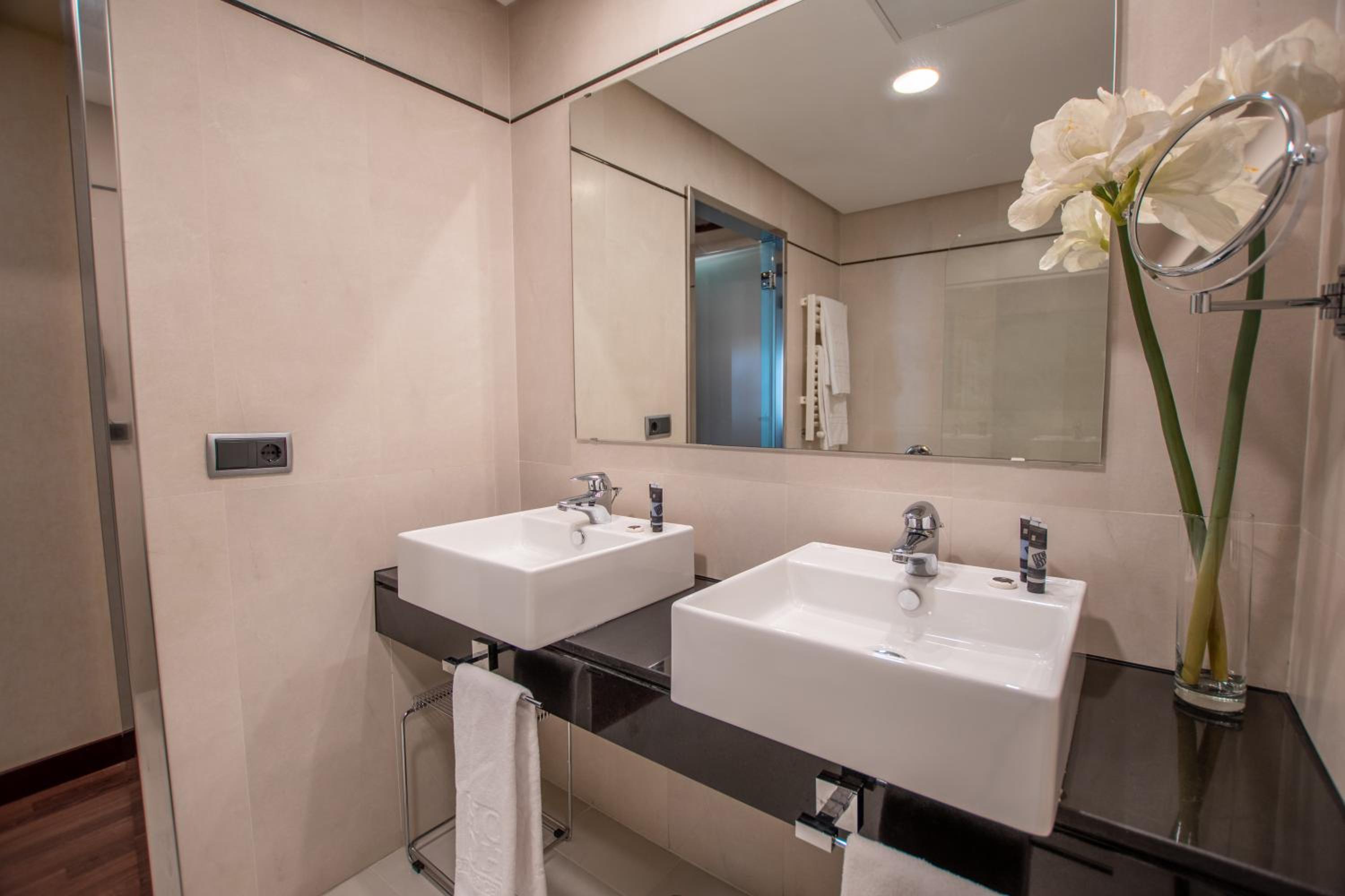 Experience luxury in our modern hotel bathrooms.