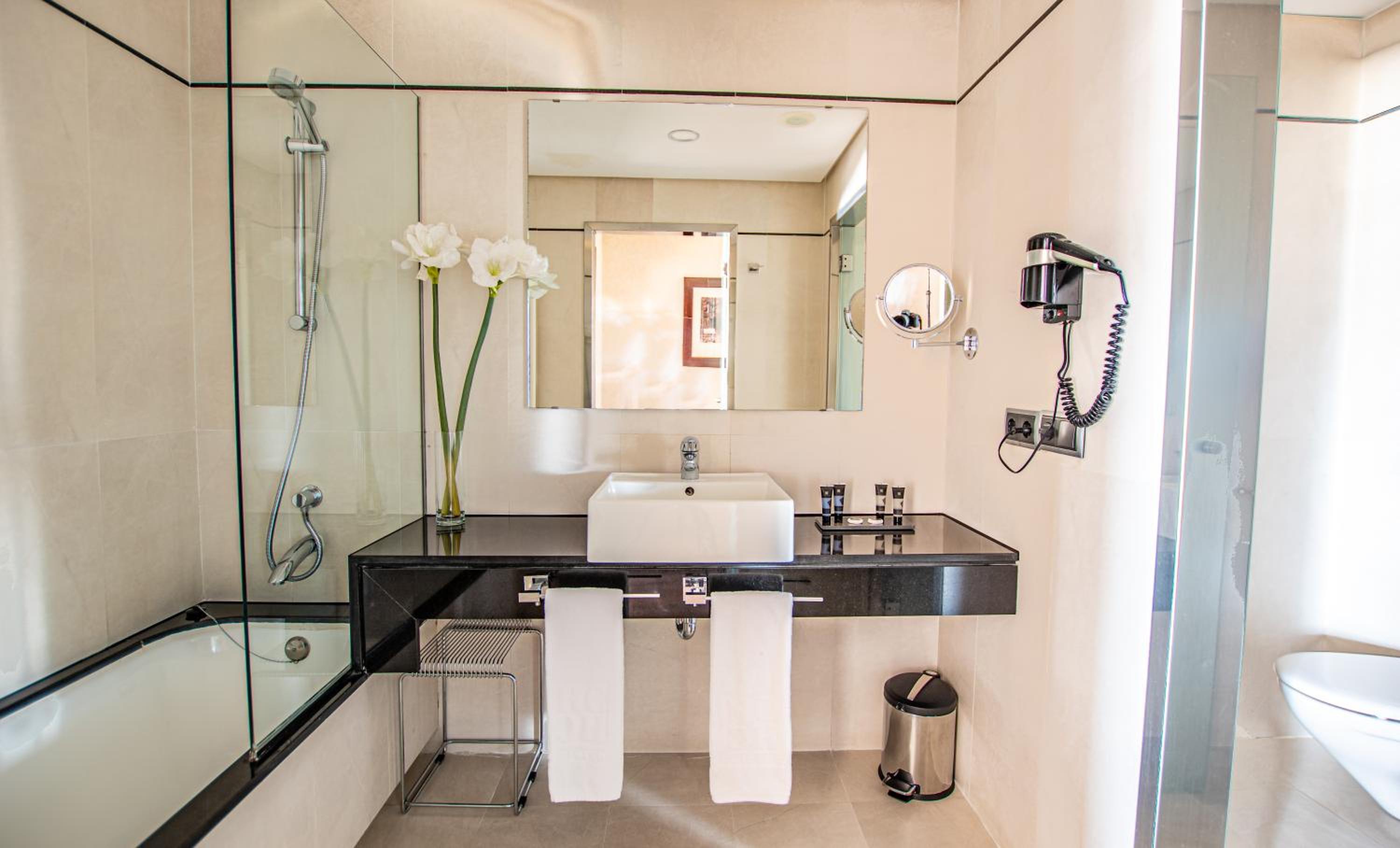 Relax in our serene and elegant bathroom oasis.