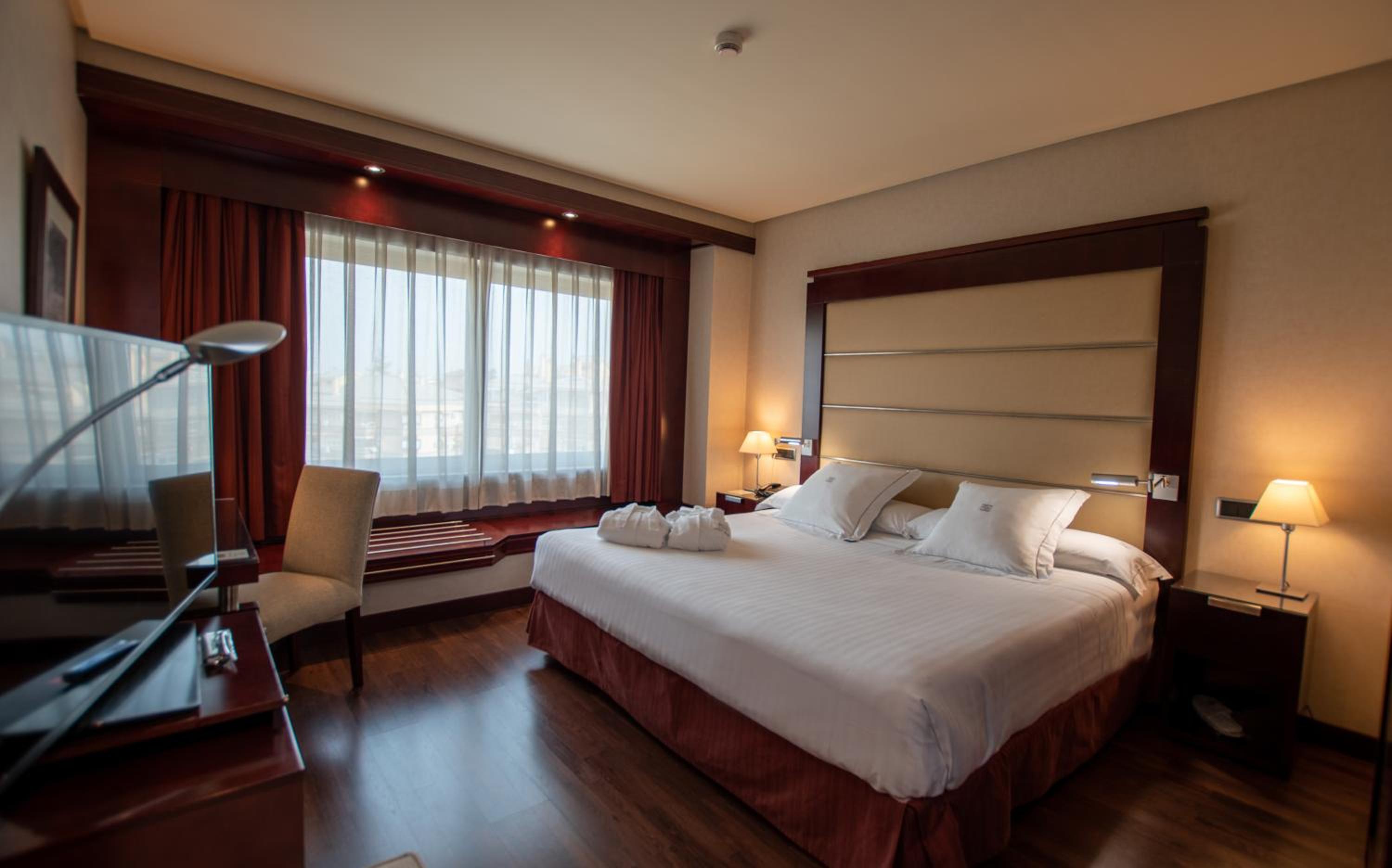Relax in this cozy and stylish hotel room.