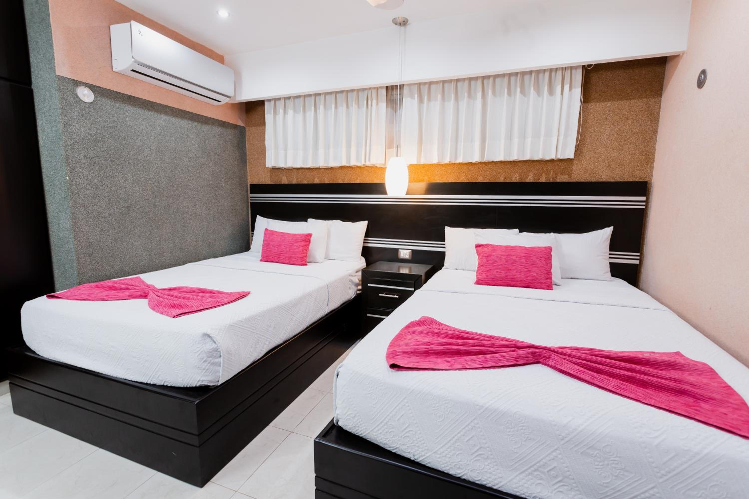 Deluxe Queen Room with Two Queen Beds photo 1