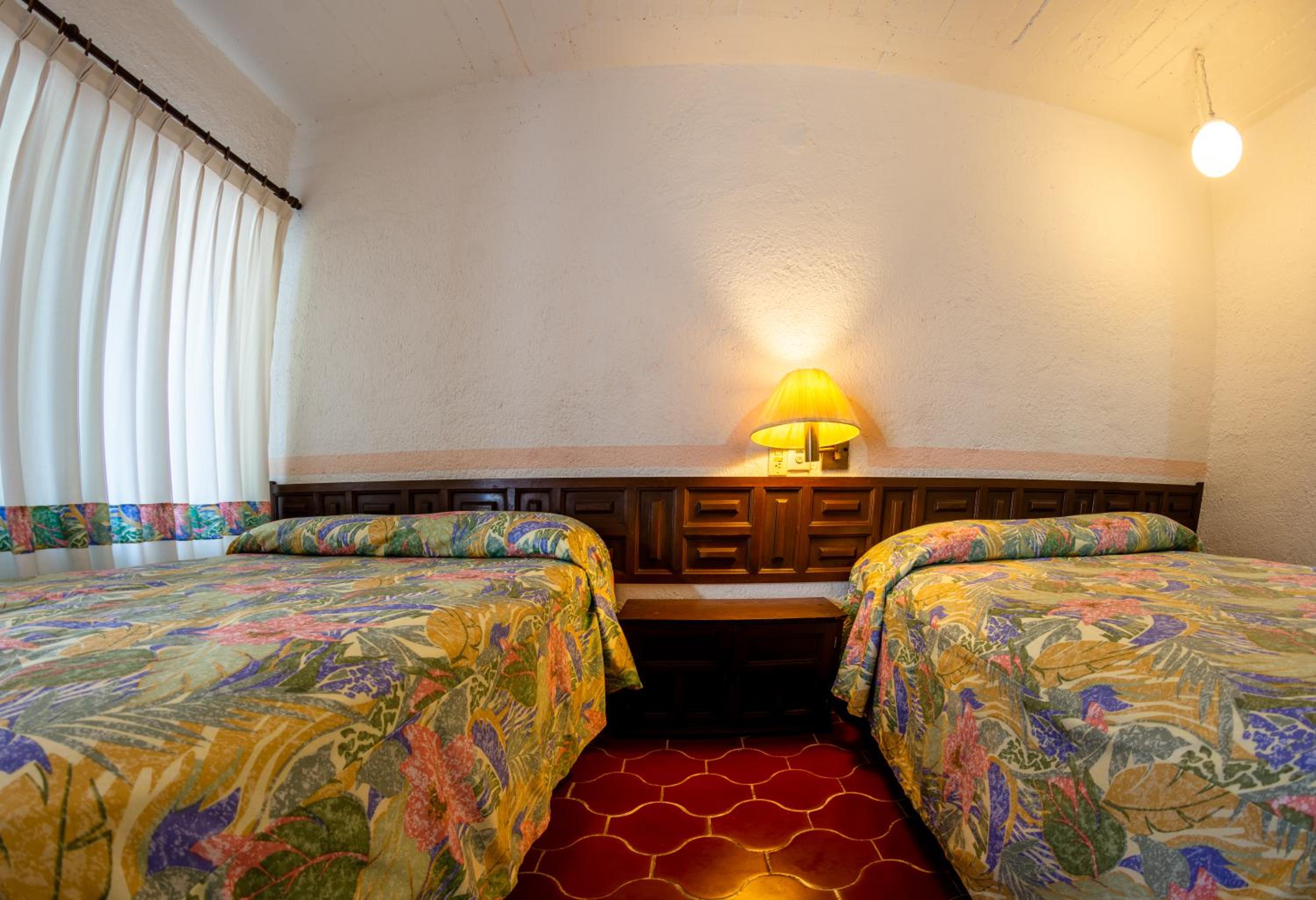 Queen Room with Two Queen Beds - Photo 6