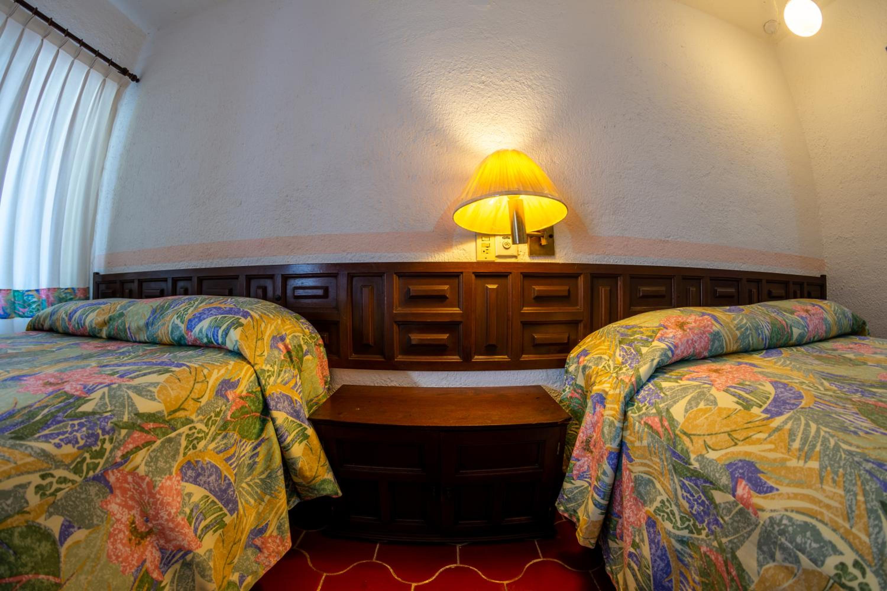 Queen Room with Two Queen Beds - Photo 1