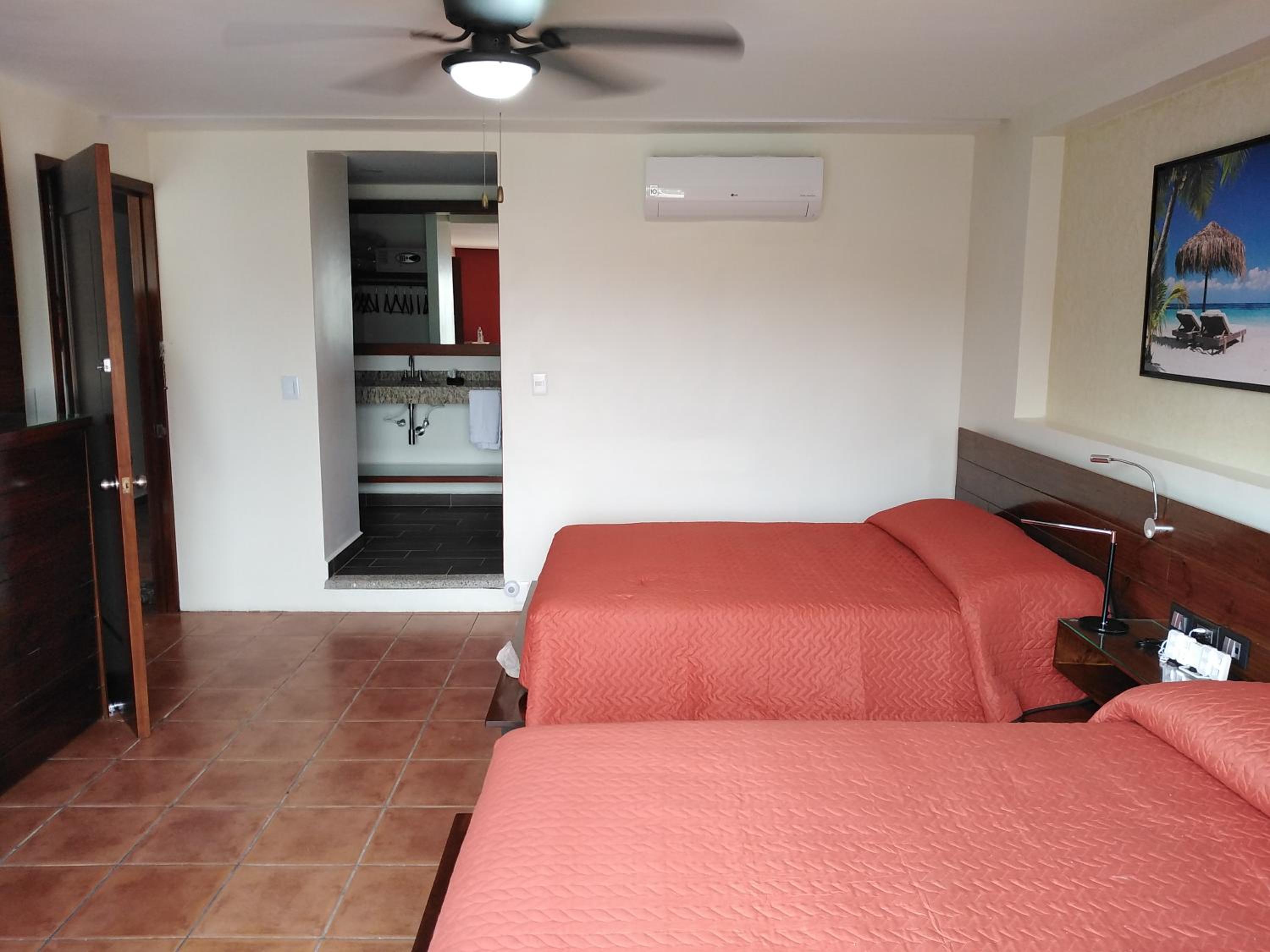 Deluxe Quadruple Room - Photo 7