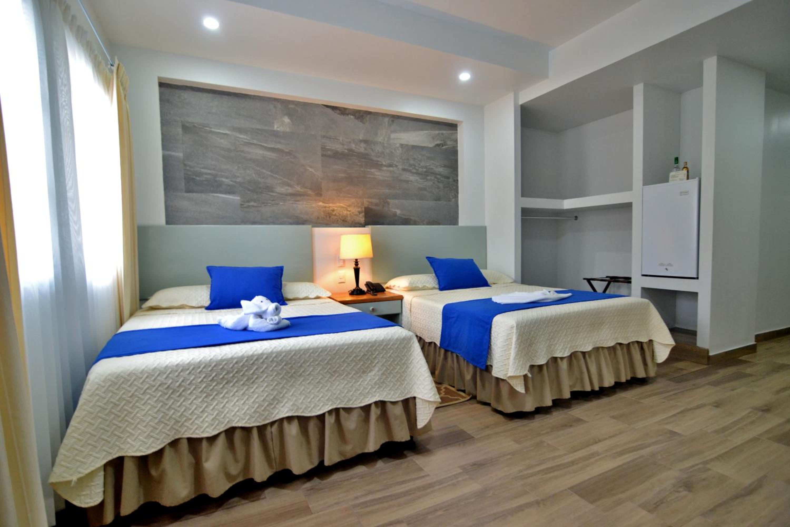 Quarto Duplo de Luxo com 2 Camas
