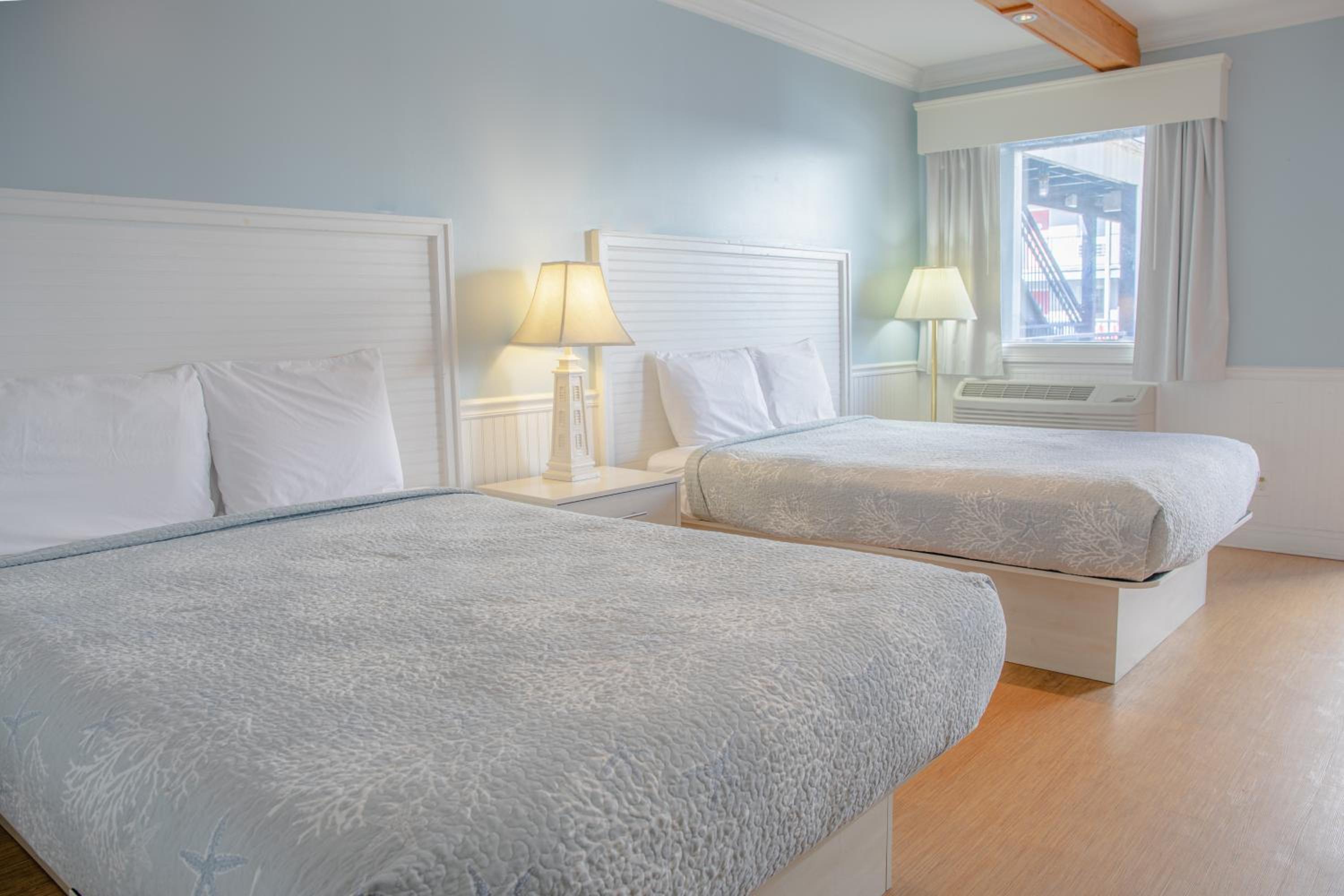 Queen Room with Two Queen Beds - Photo 9