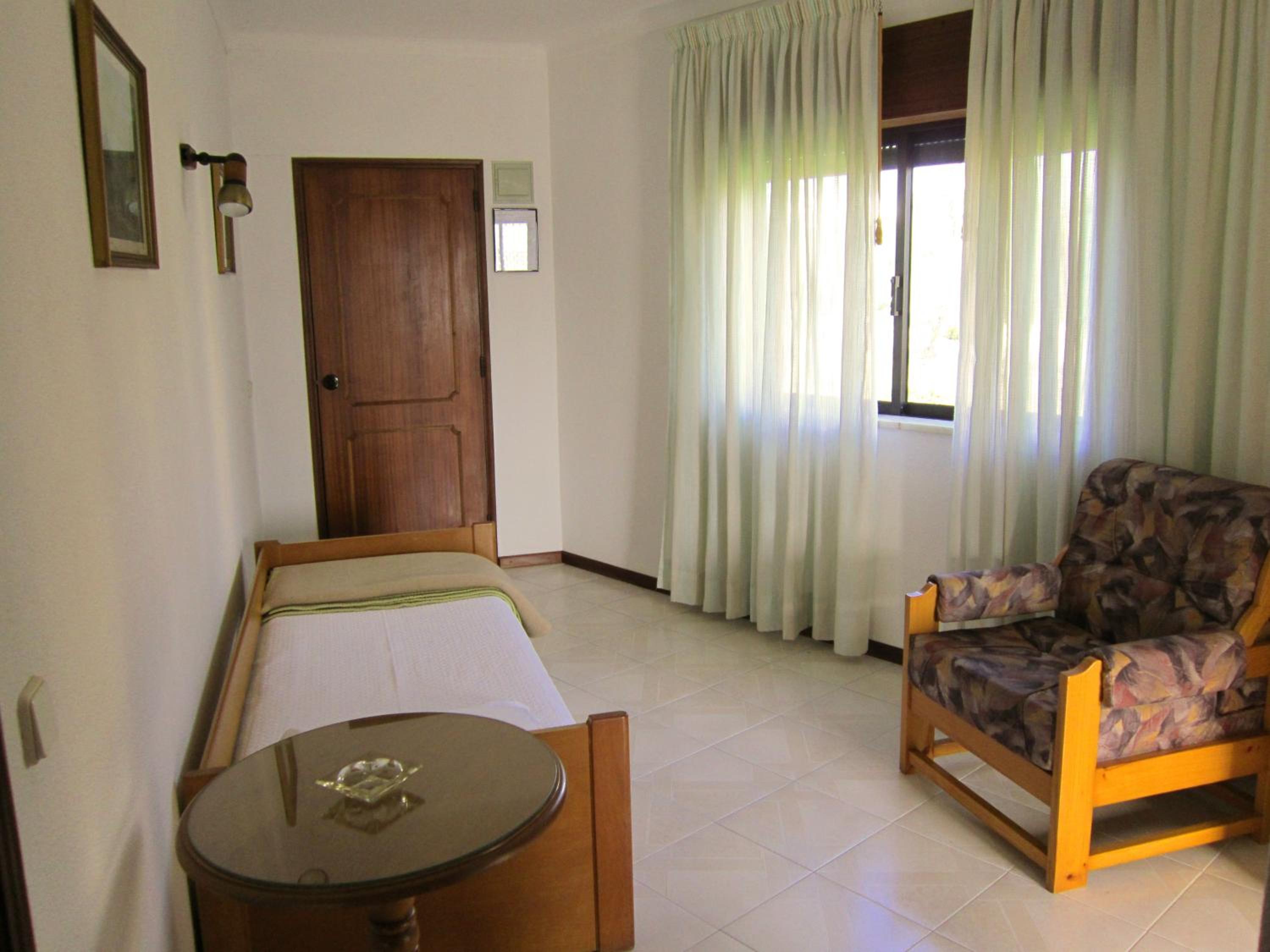 Family Room with Balcony and Pool View photo 3
