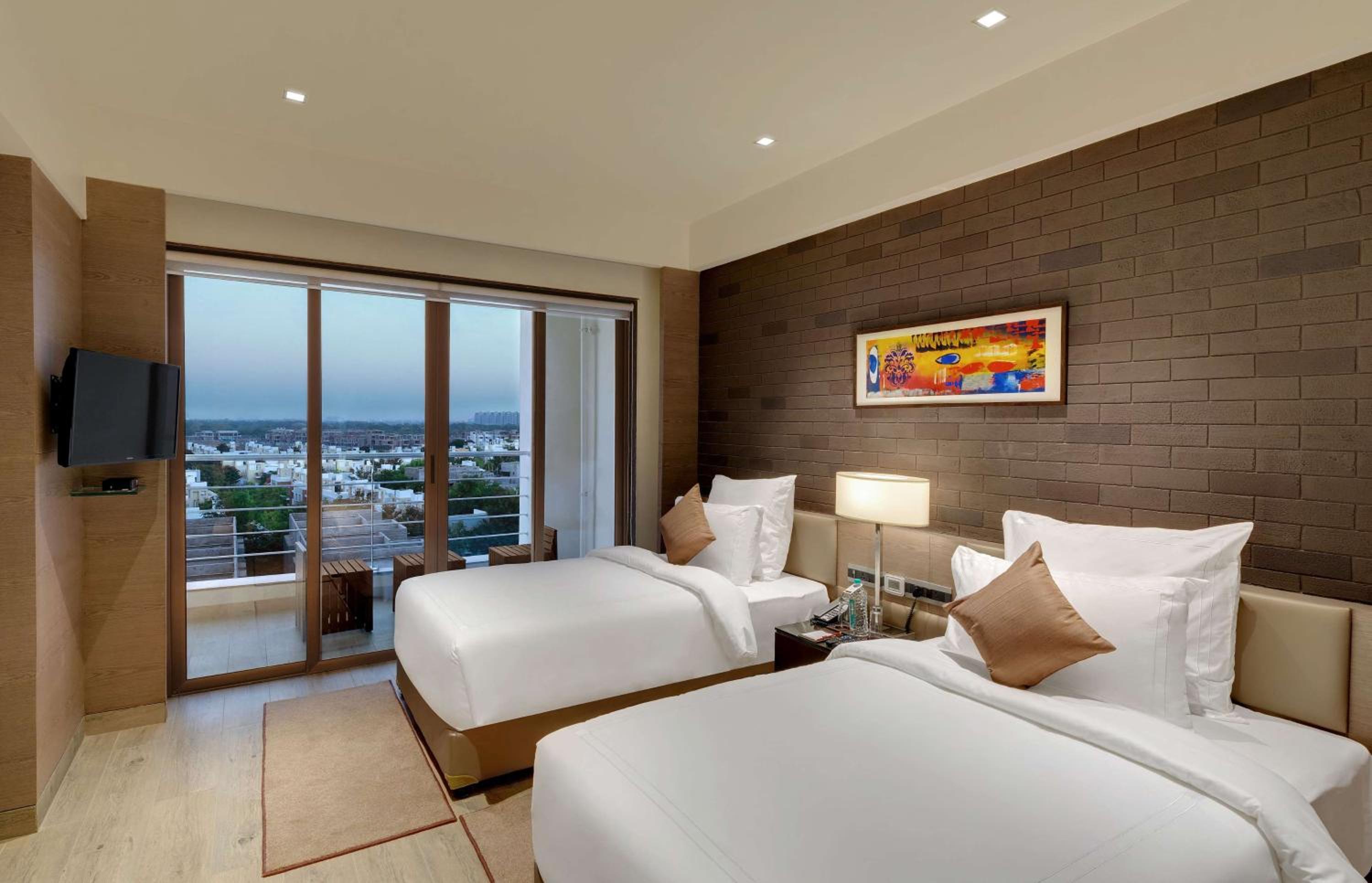 Executive Suite with One Twin Bed - Living Room and Balcony - City or Garden View - Non-Smoking