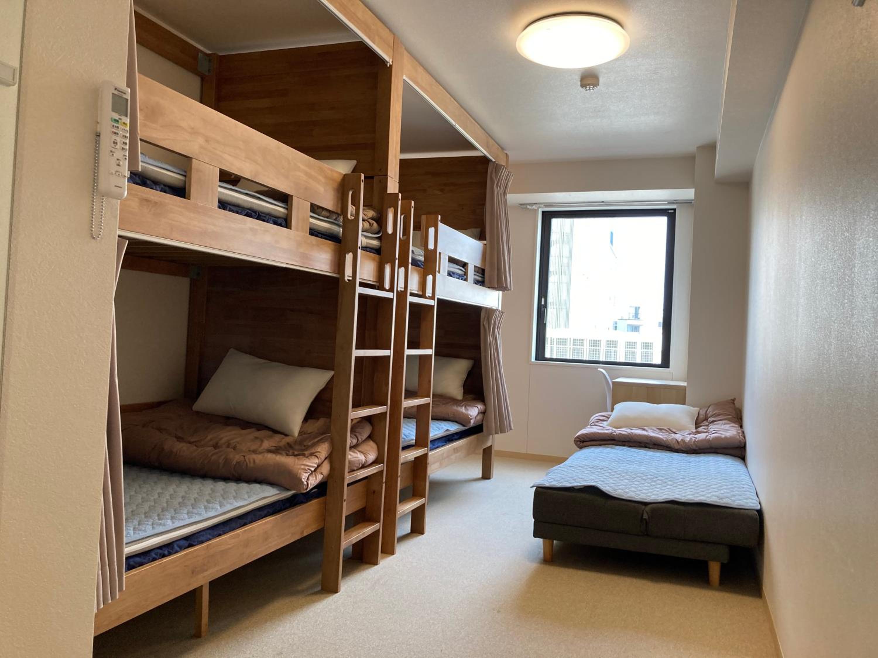 Family Room (5 Adults) with Private Bathroom and Toilet - Non-Smoking photo 1