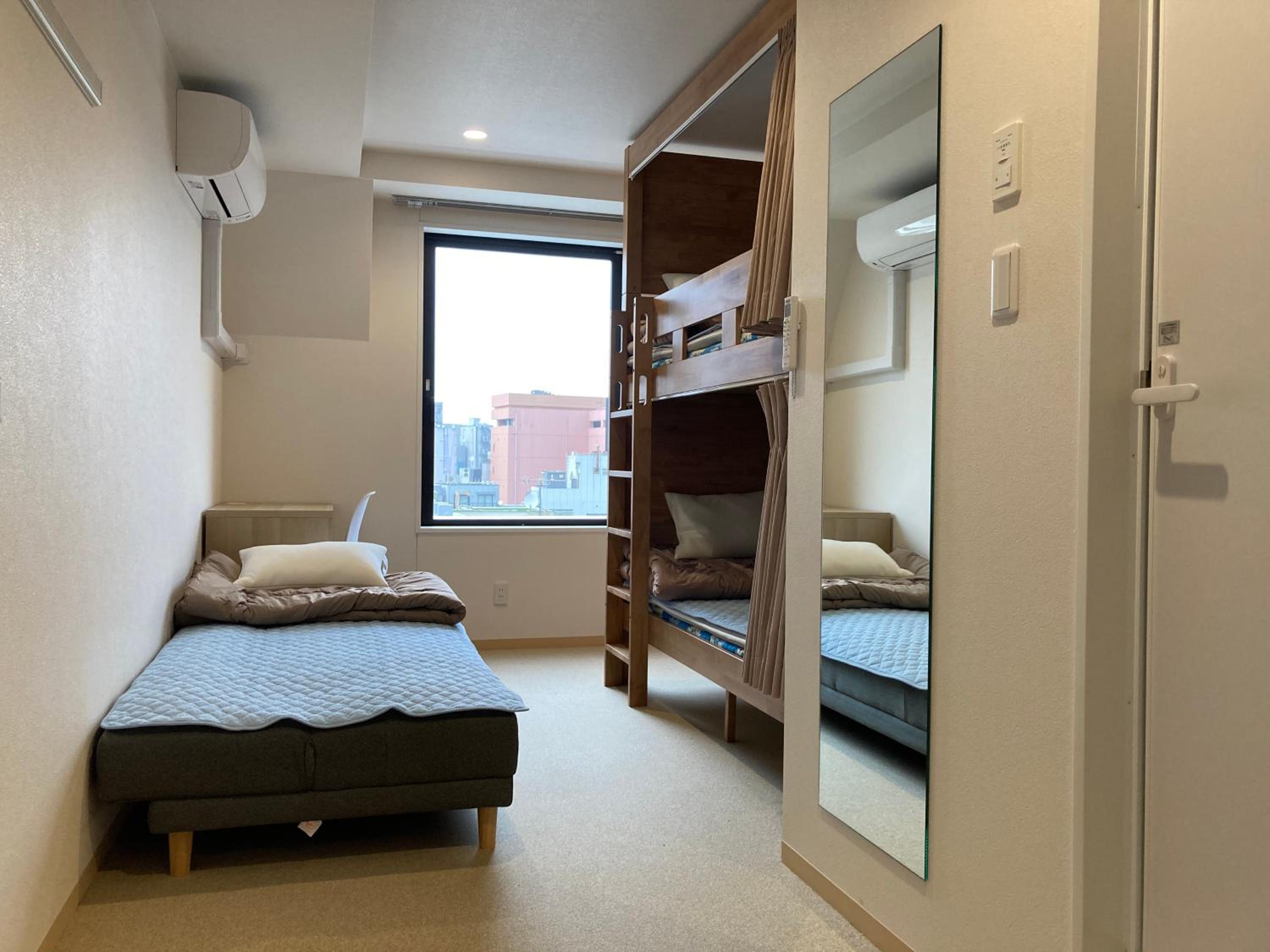 Triple Room with Private Bathroom and Toilet - Non-Smoking photo 1