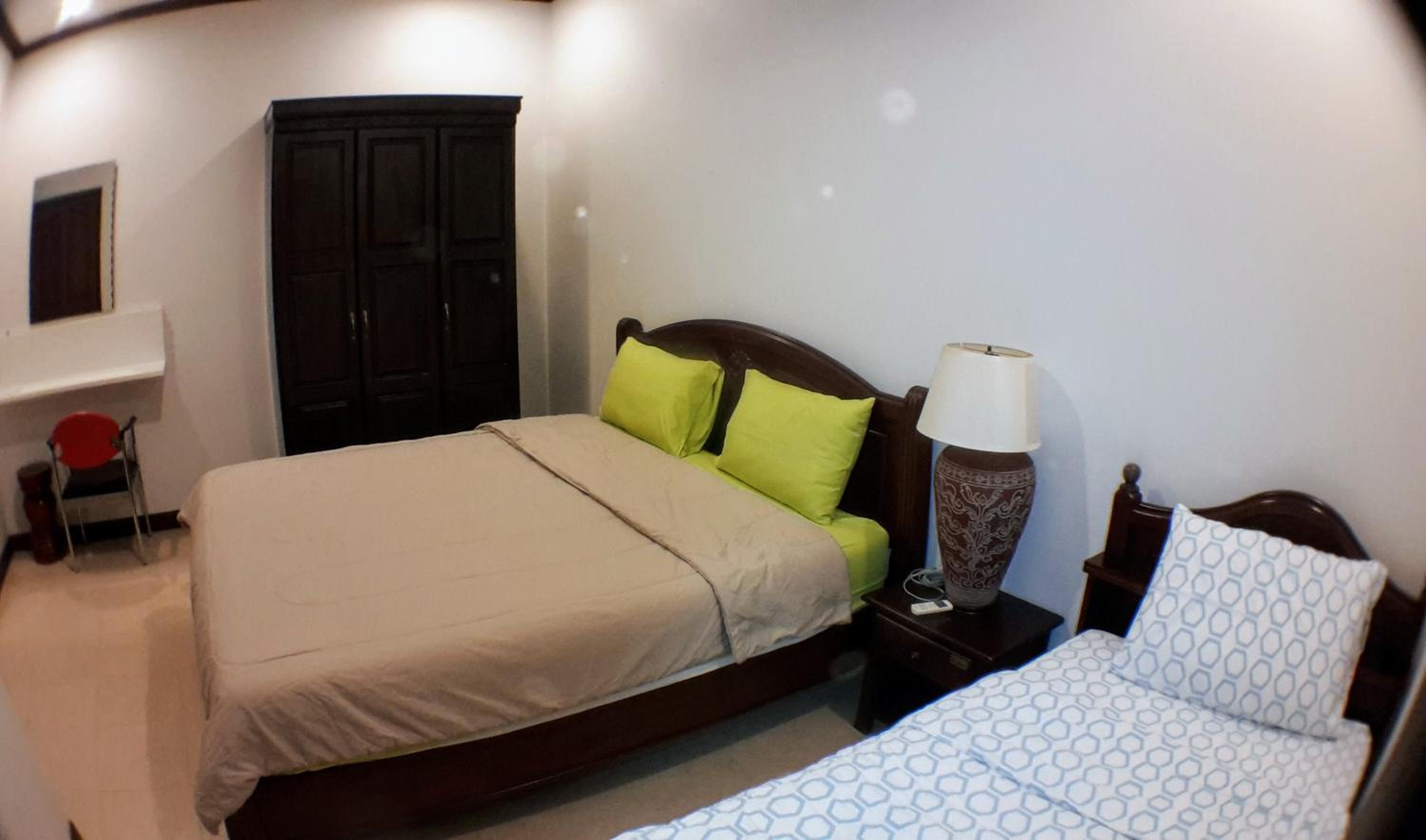 Three-Bedroom House - Photo 25