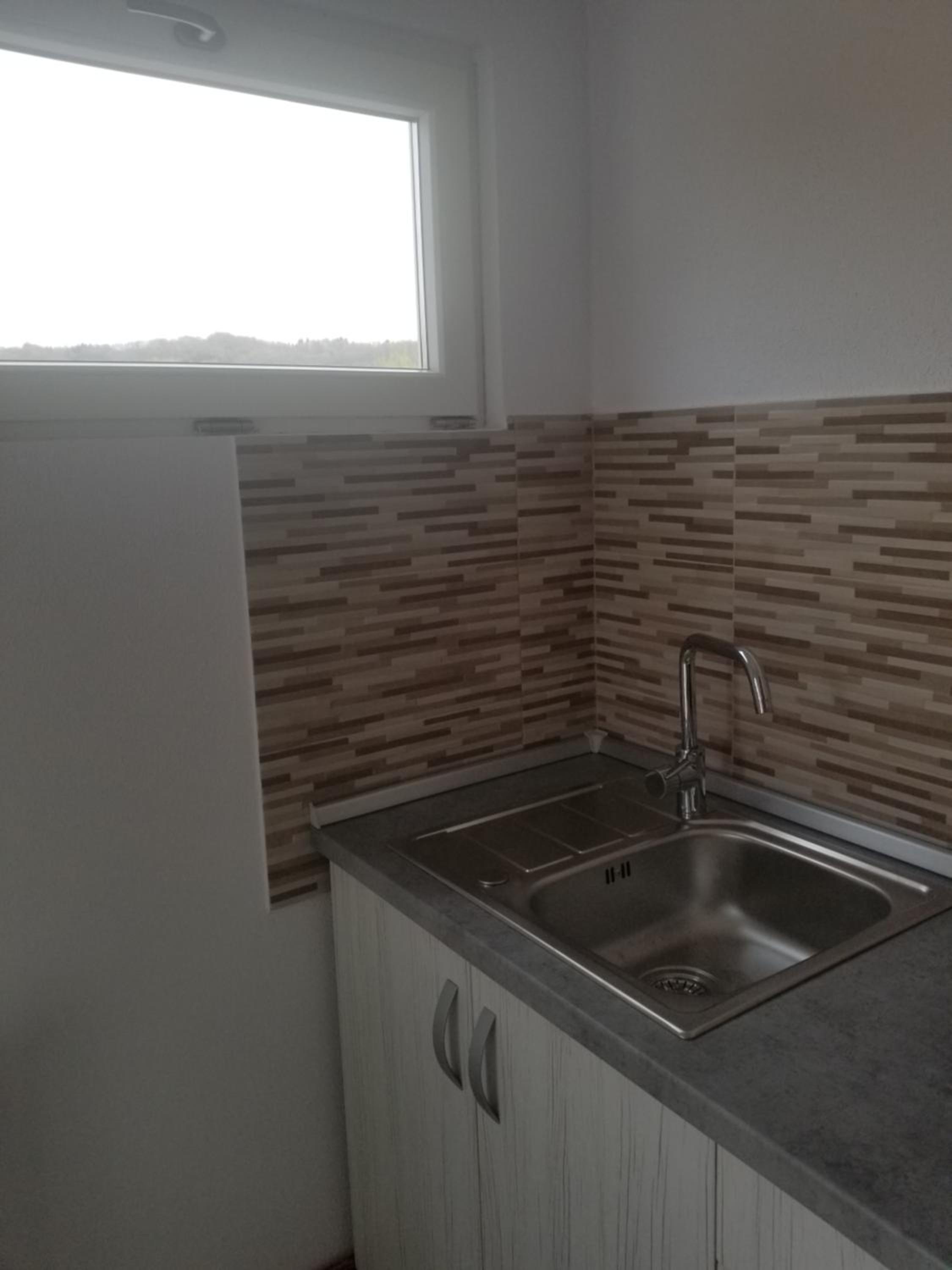 Three-Bedroom Apartment - Photo 36