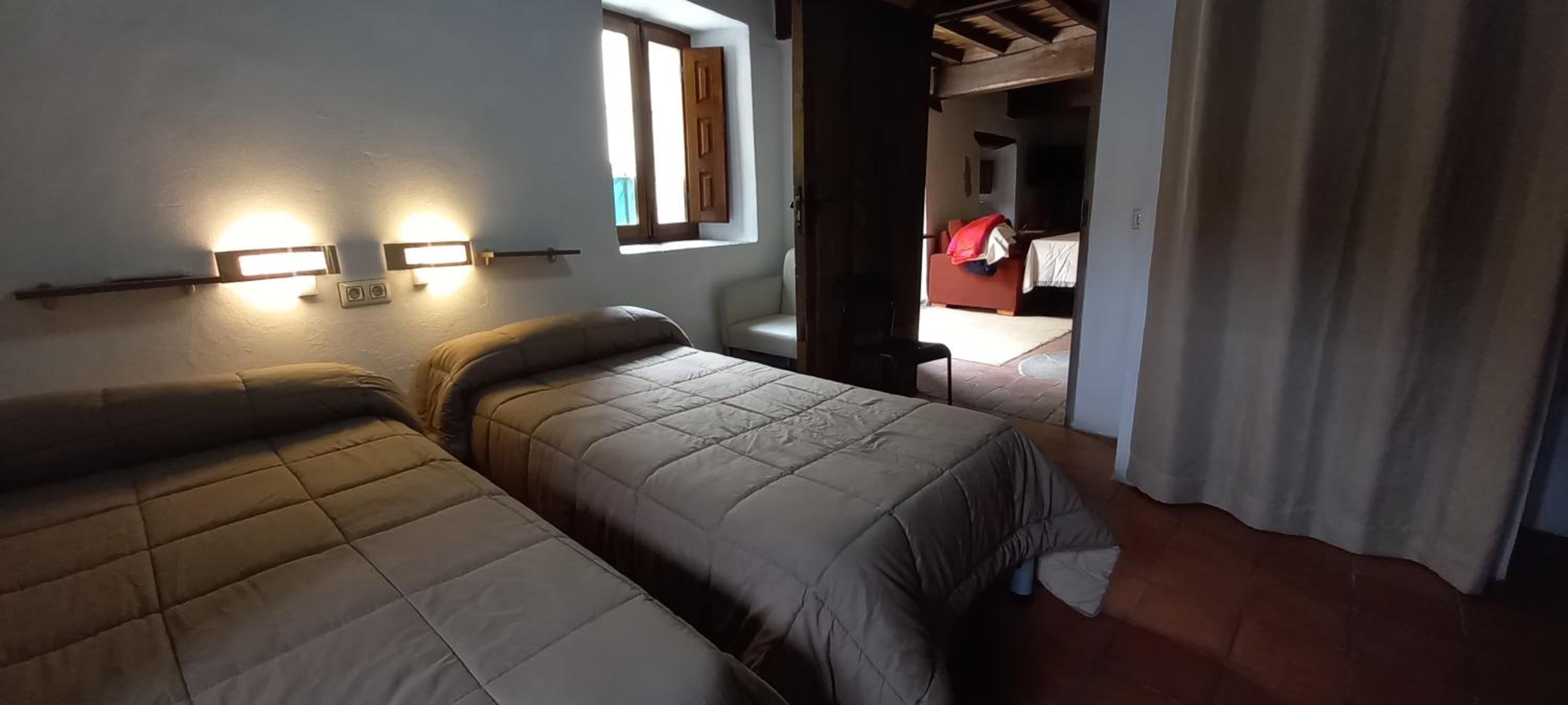 Cama individual en habitación compartida